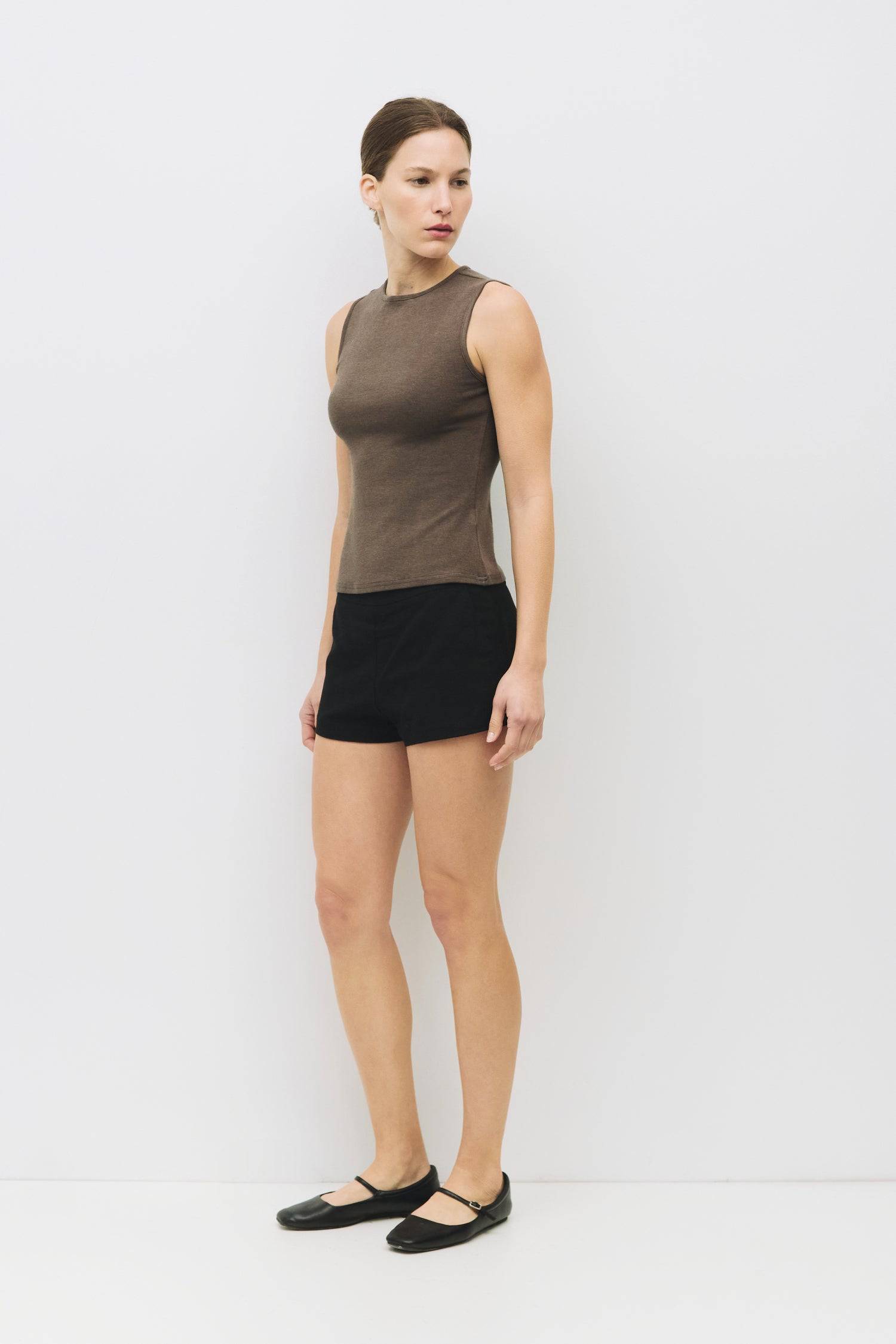 8983696900317, The Kailey Top, Tops, All Row, adjustable,adjustable ties,Black,brown,Casual,cf-color-brown,cf-color-cream,cf-color-olive,cf-size-l,cf-size-m,cf-size-s,cf-size-xl,cf-vendor-all-row,Comfortable,Cream,Crew Neckline,Everyday,flowy,Front Tie,Layers,Lightweight,Minimal,new,Relaxed,Relaxed Fit,Soft,Spring,Top,Trendy,Women's, Information The Kailey Top is a fitted sleeveless knit top with a boat neckline and a semi cut-out detail on the back, finished with a self tie. Its sleek design offers a moder