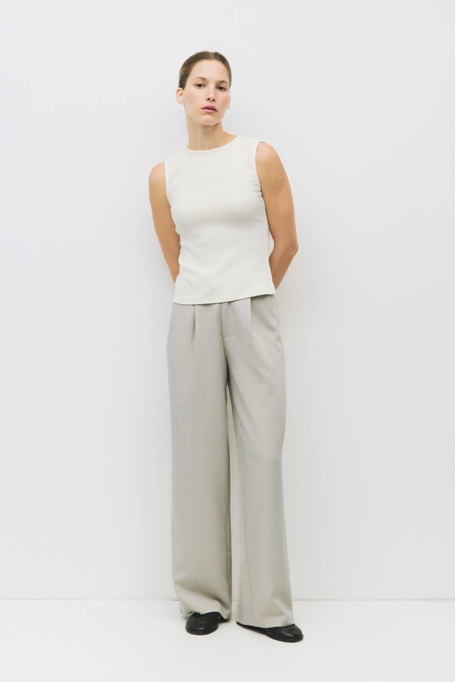 8983696900317, The Kailey Top, Tops, All Row, adjustable,adjustable ties,Black,brown,Casual,cf-color-brown,cf-color-cream,cf-color-olive,cf-size-l,cf-size-m,cf-size-s,cf-size-xl,cf-vendor-all-row,Comfortable,Cream,Crew Neckline,Everyday,flowy,Front Tie,Layers,Lightweight,Minimal,new,Relaxed,Relaxed Fit,Soft,Spring,Top,Trendy,Women's, Information The Kailey Top is a fitted sleeveless knit top with a boat neckline and a semi cut-out detail on the back, finished with a self tie. Its sleek design offers a moder