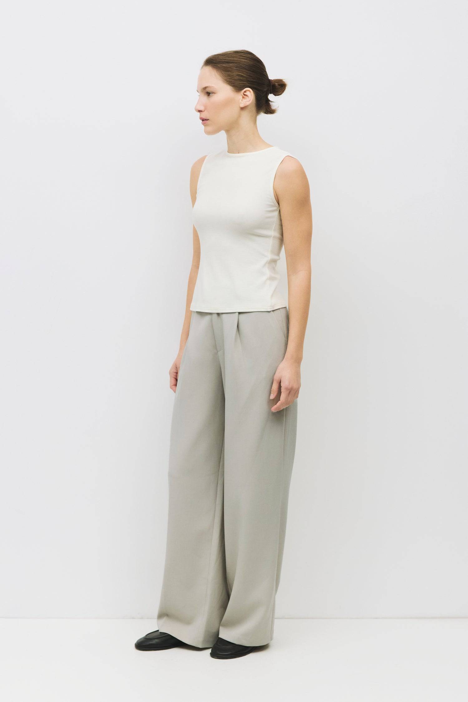 8983696900317, The Kailey Top, Tops, All Row, adjustable,adjustable ties,Black,brown,Casual,cf-color-brown,cf-color-cream,cf-color-olive,cf-size-l,cf-size-m,cf-size-s,cf-size-xl,cf-vendor-all-row,Comfortable,Cream,Crew Neckline,Everyday,flowy,Front Tie,Layers,Lightweight,Minimal,new,Relaxed,Relaxed Fit,Soft,Spring,Top,Trendy,Women's, Information The Kailey Top is a fitted sleeveless knit top with a boat neckline and a semi cut-out detail on the back, finished with a self tie. Its sleek design offers a moder