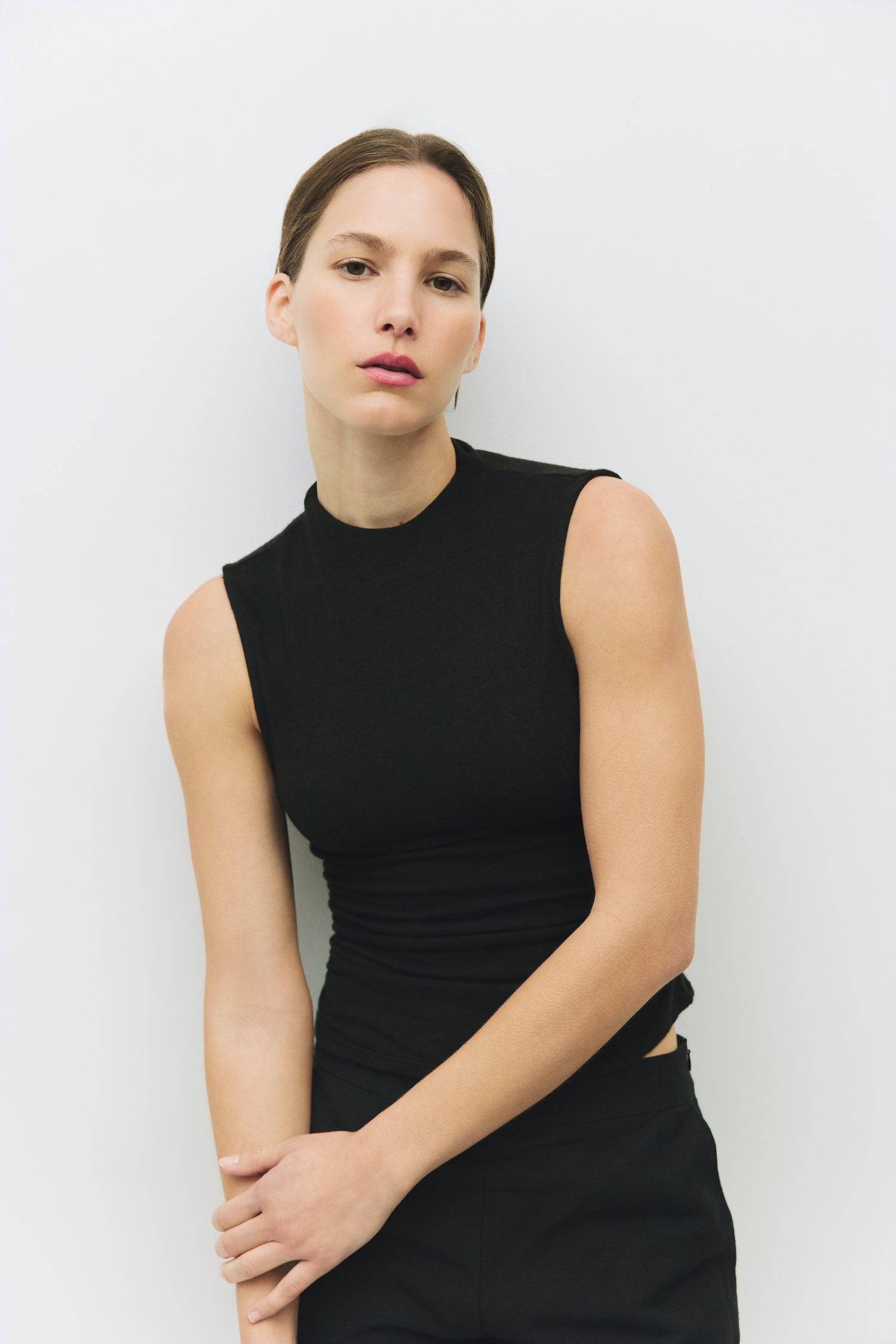 8983698866397, The Genesis Top, Tops, All Row, adjustable,adjustable ties,Black,brown,Casual,cf-color-brown,cf-color-cream,cf-color-olive,cf-size-l,cf-size-m,cf-size-s,cf-size-xl,cf-vendor-all-row,Comfortable,Cream,Crew Neckline,Everyday,flowy,Front Tie,Layers,Lightweight,Minimal,new,Relaxed,Relaxed Fit,Soft,Spring,Top,Trendy,Women's, Information The Genesis Top is a sleeveless mock neck tank featuring shirring detail at the waist for a flattering fit. Its meet-and-greet length makes it perfect for pairing