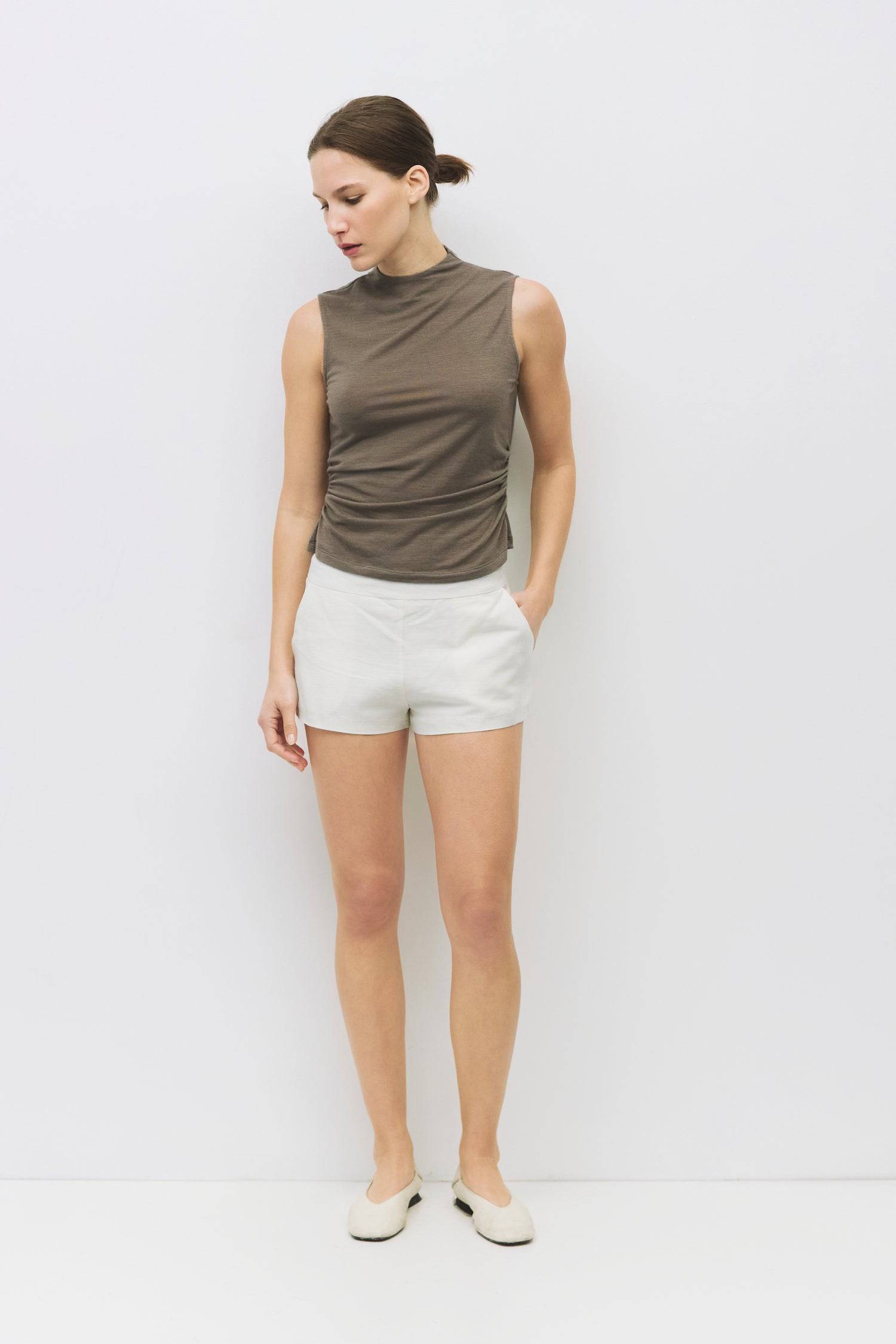 8983698866397, The Genesis Top, Tops, All Row, adjustable,adjustable ties,Black,brown,Casual,cf-color-brown,cf-color-cream,cf-color-olive,cf-size-l,cf-size-m,cf-size-s,cf-size-xl,cf-vendor-all-row,Comfortable,Cream,Crew Neckline,Everyday,flowy,Front Tie,Layers,Lightweight,Minimal,new,Relaxed,Relaxed Fit,Soft,Spring,Top,Trendy,Women's, Information The Genesis Top is a sleeveless mock neck tank featuring shirring detail at the waist for a flattering fit. Its meet-and-greet length makes it perfect for pairing