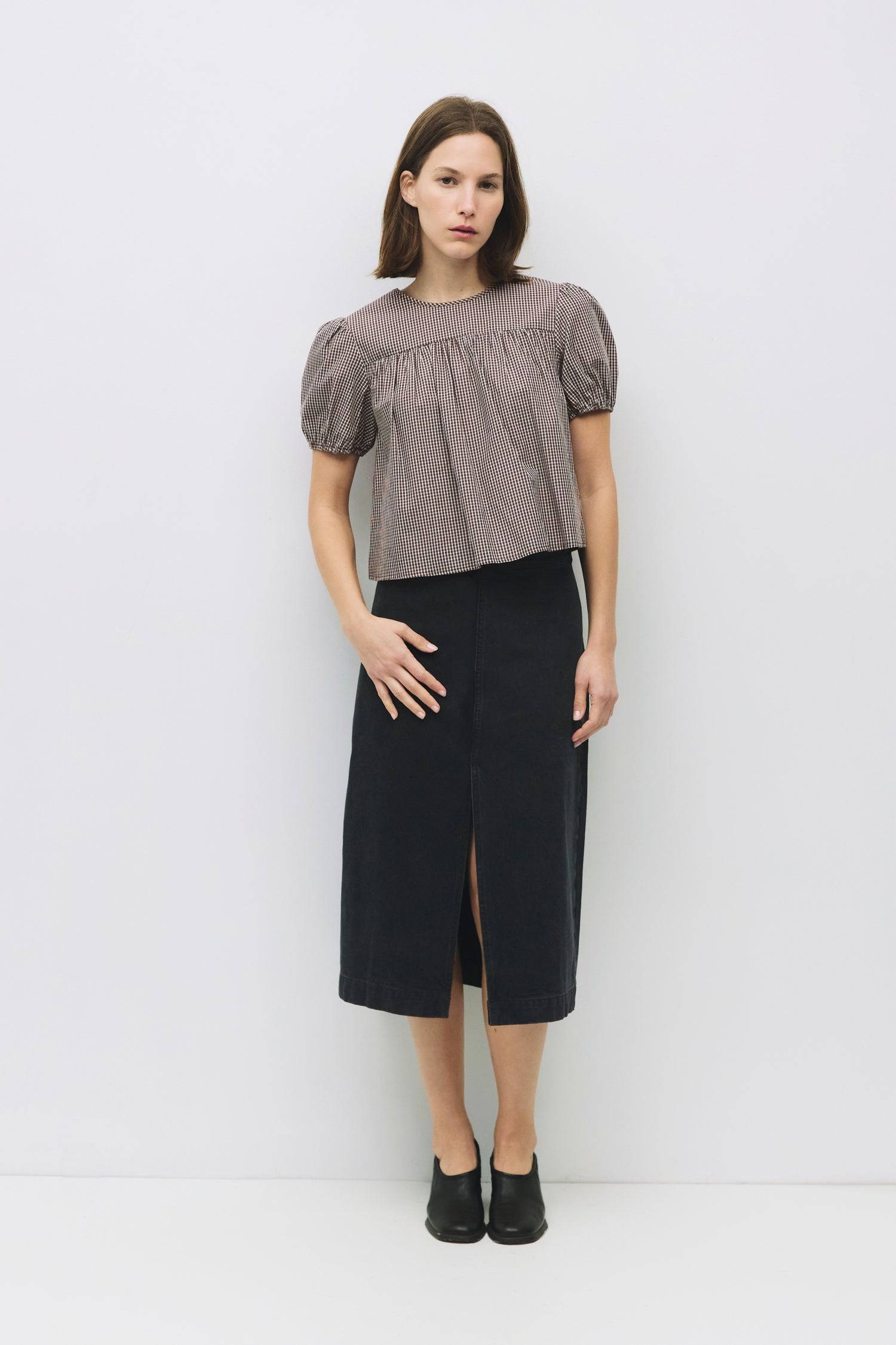 8994150711517, The Carroll Top, Tops, All Row, back tie,Black,Blue,brown,cf-color-blue,cf-color-brown,cf-color-lightblue,cf-size-l,cf-vendor-all-row,collared,Comfort,Comfortable,Cropped,cropped hemline,Feminine,gingham,Light Blue,new,plaid,Puff Sleeve,semi-cropped,Spring,versatile,Womens, Information The Carroll Top is a lightweight gingham blouse with short puff sleeves and an elastic hem for a relaxed, feminine fit. Featuring a center back tie closure and sheer front and back yokes, it’s an easy-to-wear p