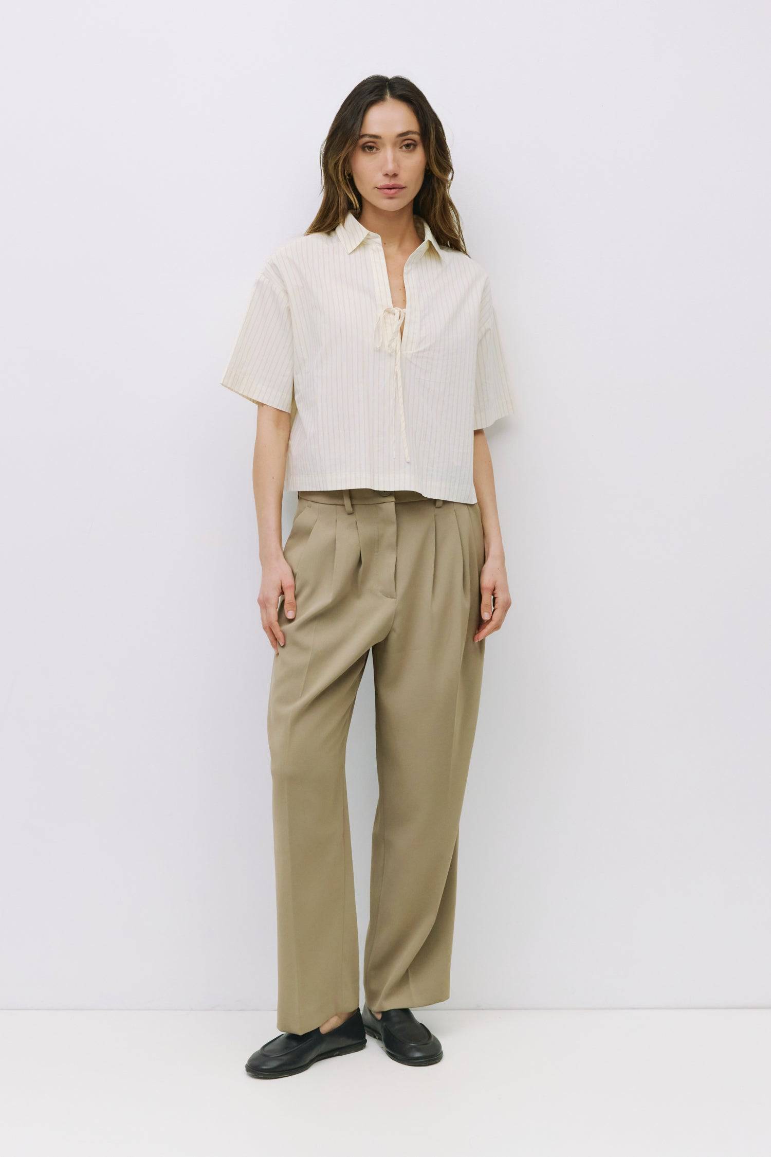 8994112209117, The Madden Top, Tops, All Row, All Row,allrow,beige,Black,Casual,cf-color-beige,cf-color-black,cf-color-white,cf-size-l,cf-size-m,cf-size-s,cf-vendor-all-row,Comfortable,Cozy,flattering,knit,new,off shoulder,set,Sets,Short Sleeve,Spring,Summer,Twist,Women's,womens top, Information The Madden Top is a pinstripe collared shirt with a relaxed, boxy fit, mid-length sleeves, tie front, and side slits for an easy, modern silhouette. Details 100% Cotton Boxy Fit Tie Front Side Slit Detail Collared V