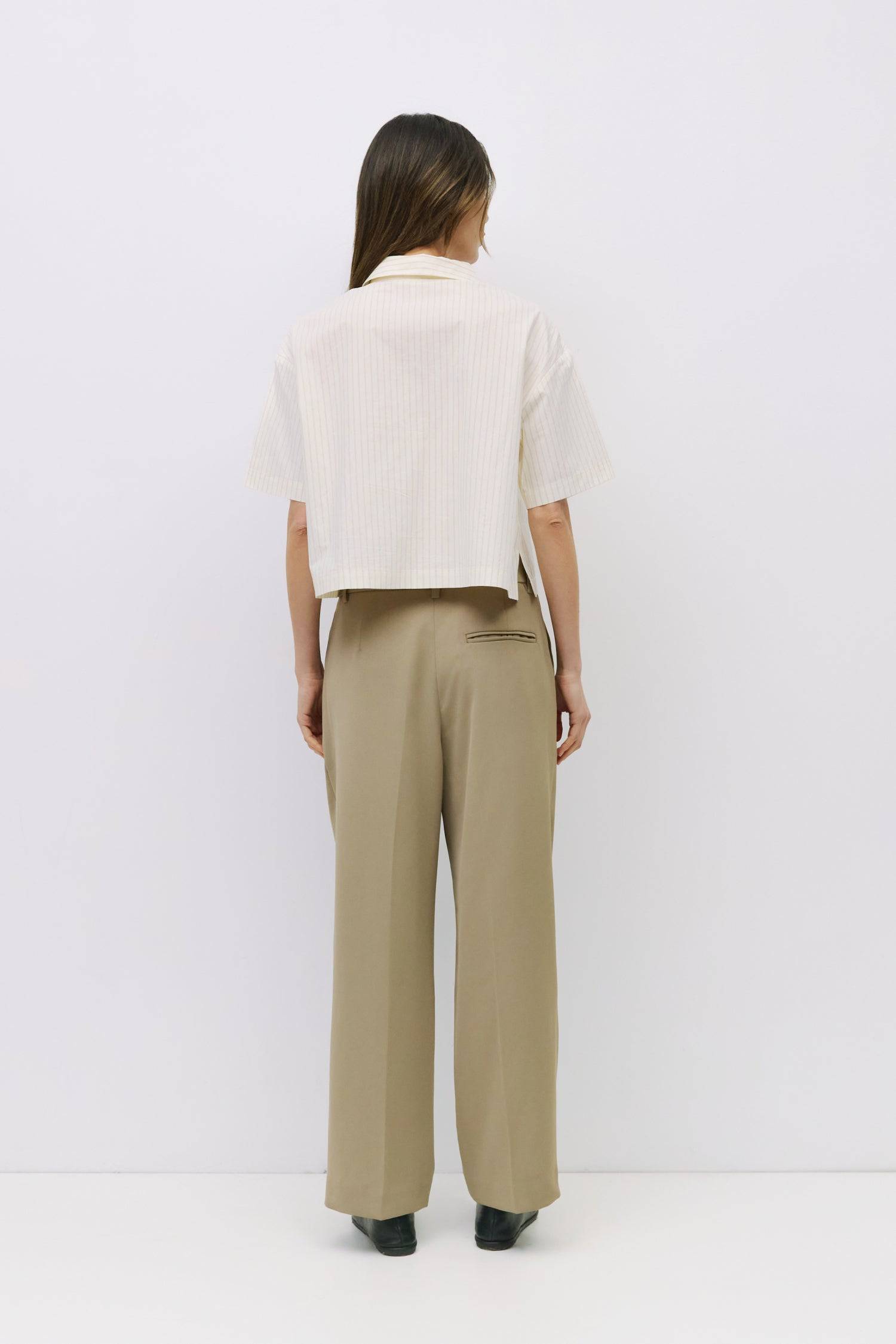 8994112209117, The Madden Top, Tops, All Row, All Row,allrow,beige,Black,Casual,cf-color-beige,cf-color-black,cf-color-white,cf-size-l,cf-size-m,cf-size-s,cf-vendor-all-row,Comfortable,Cozy,flattering,knit,new,off shoulder,set,Sets,Short Sleeve,Spring,Summer,Twist,Women's,womens top, Information The Madden Top is a pinstripe collared shirt with a relaxed, boxy fit, mid-length sleeves, tie front, and side slits for an easy, modern silhouette. Details 100% Cotton Boxy Fit Tie Front Side Slit Detail Collared V