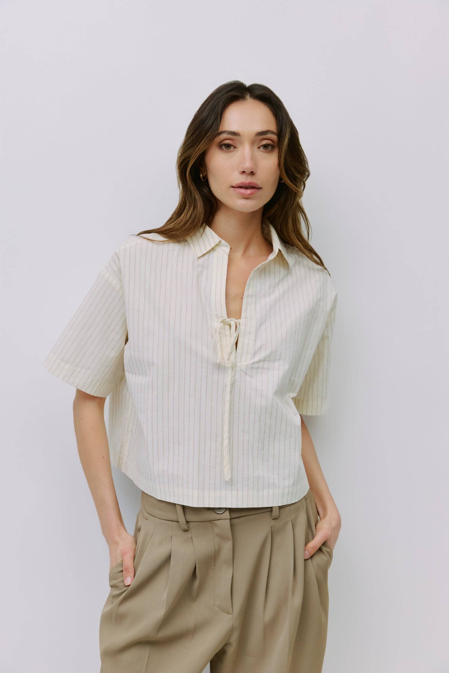 8994112209117, The Madden Top, Tops, All Row, All Row,allrow,beige,Black,Casual,cf-color-beige,cf-color-black,cf-color-white,cf-size-l,cf-size-m,cf-size-s,cf-vendor-all-row,Comfortable,Cozy,flattering,knit,new,off shoulder,set,Sets,Short Sleeve,Spring,Summer,Twist,Women's,womens top, Information The Madden Top is a pinstripe collared shirt with a relaxed, boxy fit, mid-length sleeves, tie front, and side slits for an easy, modern silhouette. Details 100% Cotton Boxy Fit Tie Front Side Slit Detail Collared V