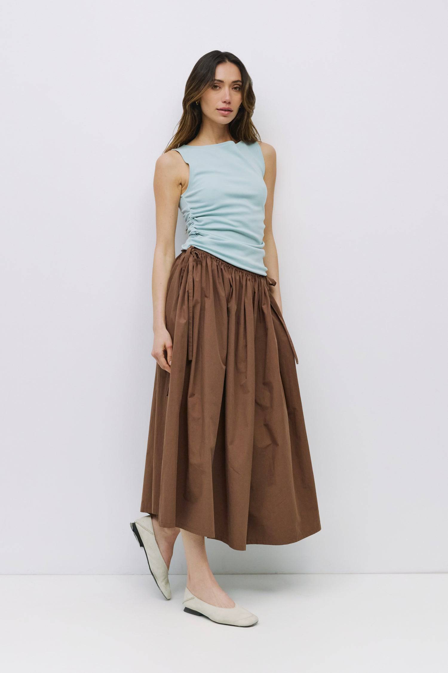 9023159927005, The Jordyn Top, Tops, All Row, Blue,boat neck,boat neckline,Bone,brown,Casual,cf-color-brown,cf-size-l,cf-size-m,cf-size-s,cf-size-xl,cf-vendor-all-row,cinched,Cinched Waist,Comfortable,Cotton,Cream,Crew Neckline,Everyday,Form Fitting,Layers,Light Blue,Minimal,new,Sleeveless,Soft,Spring,Summer,Top,Transitional,Trendy,Women's, Information The Jordyn Top is a form-fitting sleeveless tank crafted from a soft midweight knit. Designed with a boat neckline and side ruching at the waist for a subtle