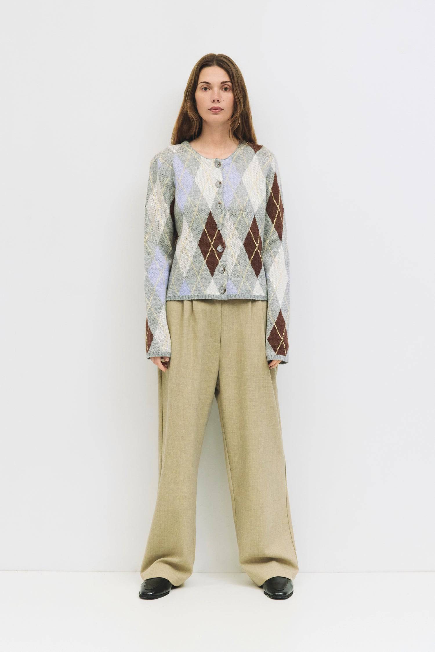 9084469608669, The Gayle Cardigan, Outerwear, Mod Ref, Acrylic,Cardigan,Casual,cf-color-grey,cf-color-sage,cf-size-l,cf-size-m,cf-size-s,cf-size-xl,cf-size-xs,cf-vendor-mod-ref,crewneck,Everyday,fall,Grey,Heather Grey,Long Sleeve,Mod Ref,modref,new,Pullover,Relaxed,Relaxed Fit,Sweater,Transitional,Women's,Wool,wool blend, Information The Gayle Cardigan is a relaxed-fit knit featuring a classic argyle design. It has a crewneck, long sleeves, and a front button closure. Made from midweight knit, it’s a timele