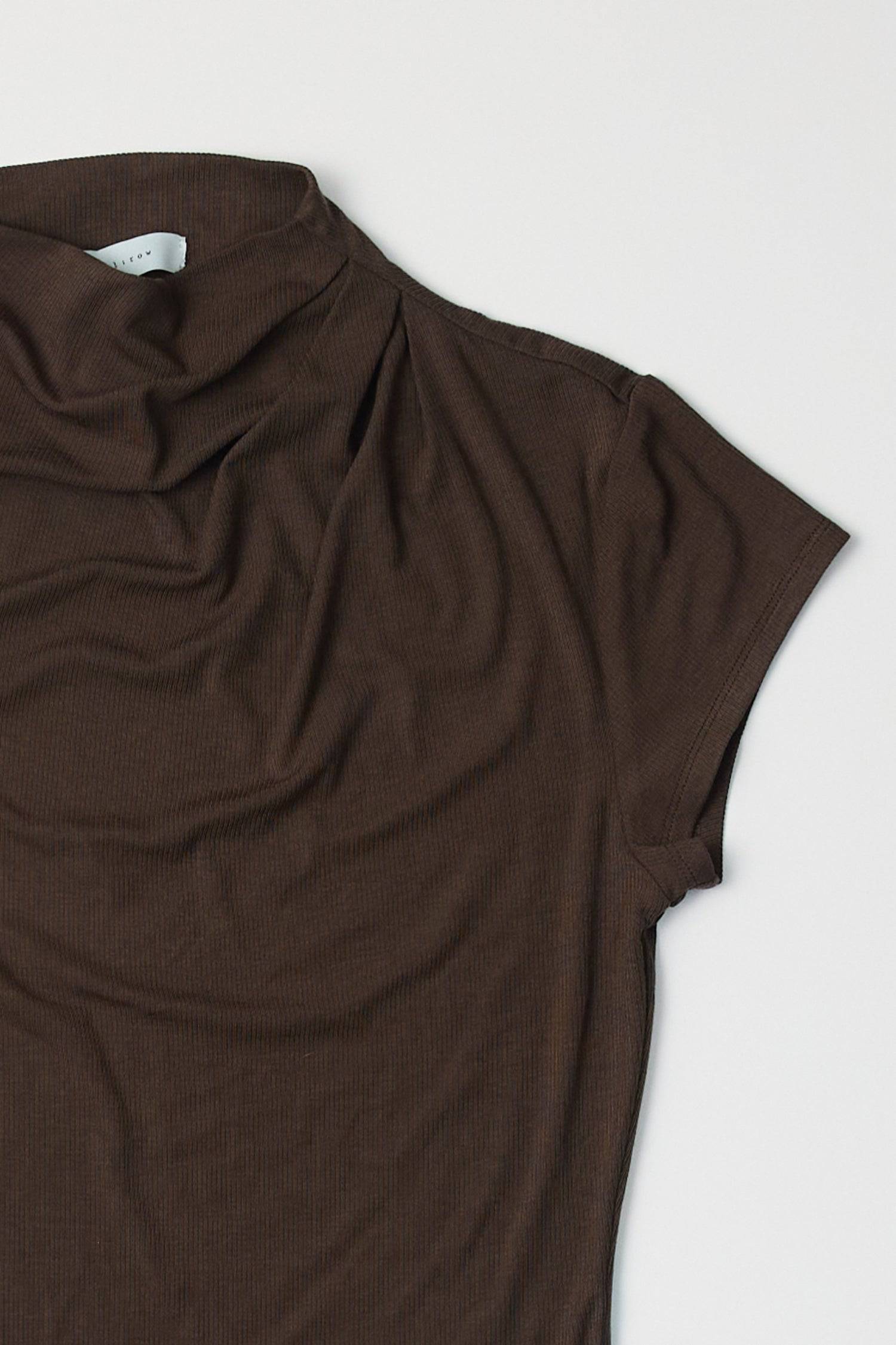 8994170470621, The Marissa Top, Tops, All Row, Cap Sleeve,Comfort,Comfortable,Cowl,cowl neck,Feminine,Form Fitting,Mock neck,new,Ribbed,Ribbed Fabric,Ribbed Top,Short Sleeve,Spring,Tops,versatile,white,Womens,womens top, Information The Marissa Top is a form-fitting ribbed knit top that features a mock cowl neck and subtle shoulder pleating for added texture. With cap sleeves and a sleek silhouette, it offers a modern, refined look. Details Self: 50% Modal, 35% Acrylic, 8% Wool, 7% Spandex Form Fitting Mock