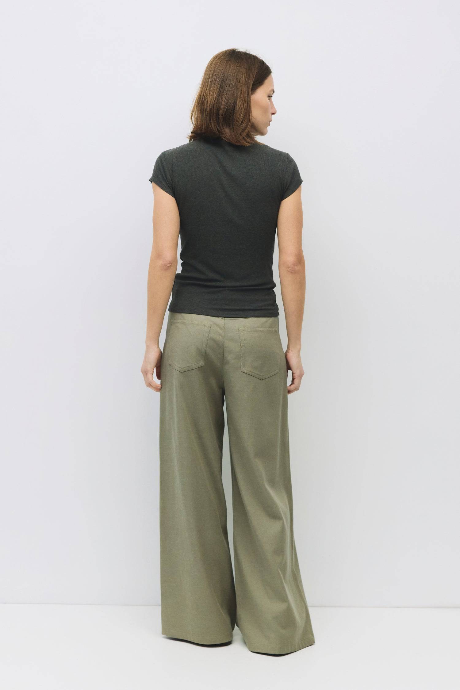 8994170470621, The Marissa Top, Tops, All Row, Cap Sleeve,Comfort,Comfortable,Cowl,cowl neck,Feminine,Form Fitting,Mock neck,new,Ribbed,Ribbed Fabric,Ribbed Top,Short Sleeve,Spring,Tops,versatile,white,Womens,womens top, Information The Marissa Top is a form-fitting ribbed knit top that features a mock cowl neck and subtle shoulder pleating for added texture. With cap sleeves and a sleek silhouette, it offers a modern, refined look. Details Self: 50% Modal, 35% Acrylic, 8% Wool, 7% Spandex Form Fitting Mock