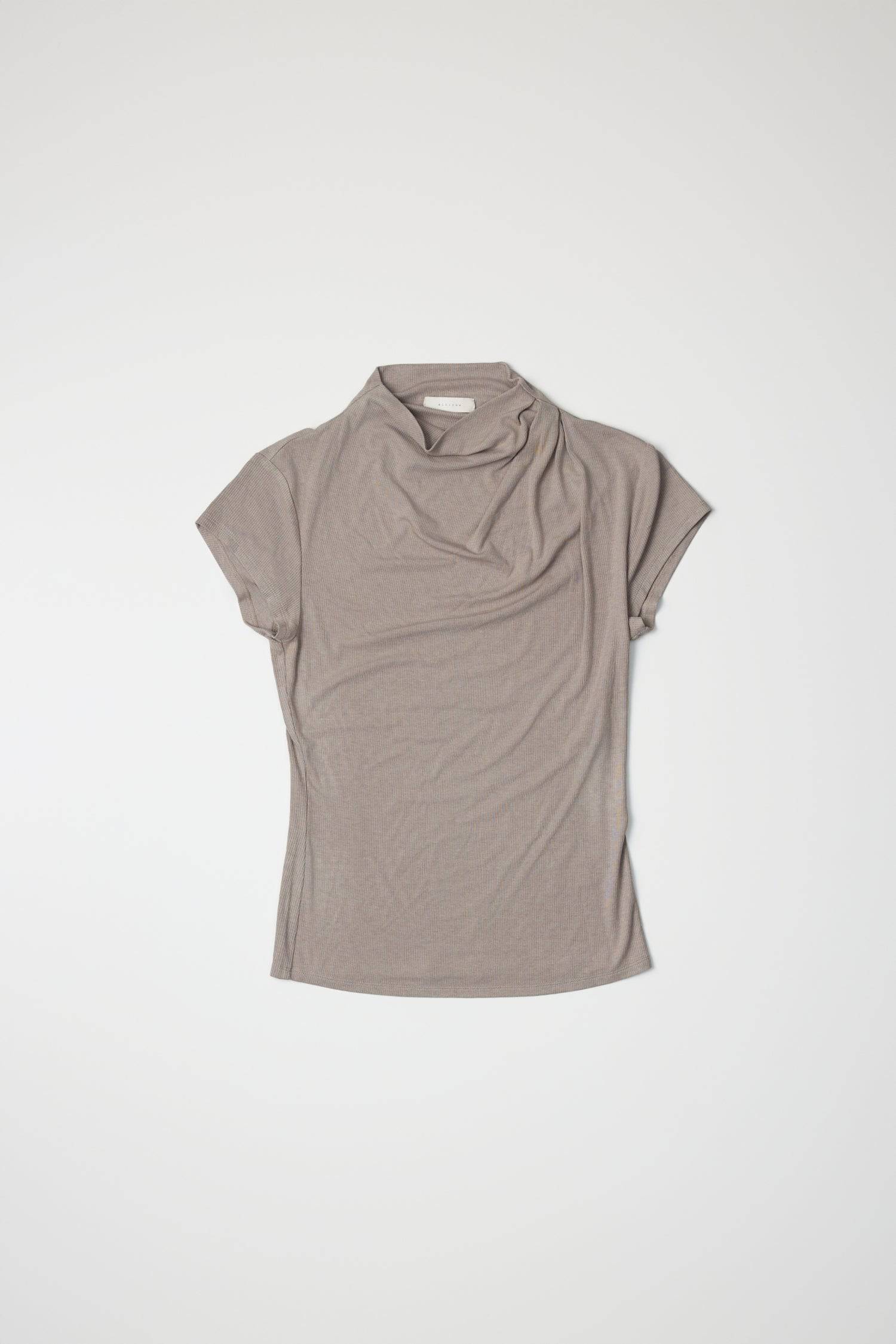 8994170470621, The Marissa Top, Tops, All Row, Cap Sleeve,Comfort,Comfortable,Cowl,cowl neck,Feminine,Form Fitting,Mock neck,new,Ribbed,Ribbed Fabric,Ribbed Top,Short Sleeve,Spring,Tops,versatile,white,Womens,womens top, Information The Marissa Top is a form-fitting ribbed knit top that features a mock cowl neck and subtle shoulder pleating for added texture. With cap sleeves and a sleek silhouette, it offers a modern, refined look. Details Self: 50% Modal, 35% Acrylic, 8% Wool, 7% Spandex Form Fitting Mock