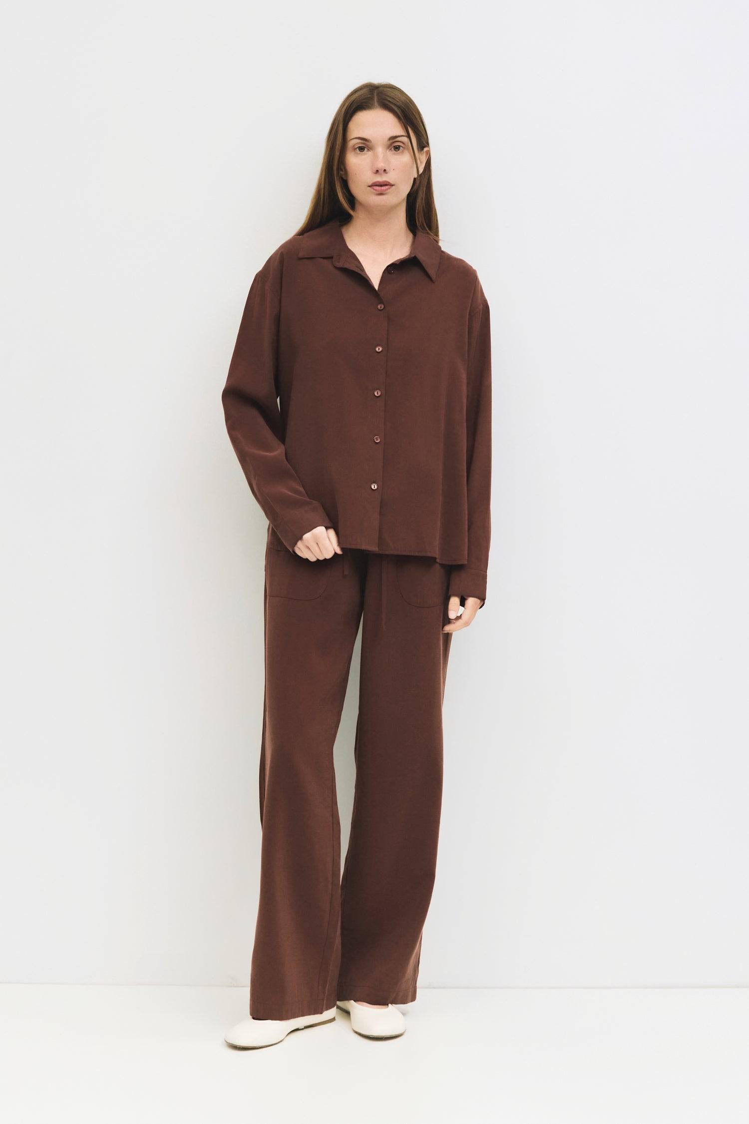 9084434645213, The Ellis Top, Tops, All Row, All Row,allrow,Blue,brown,Button Down Shirt,Casual,cf-color-blue,cf-color-brown,cf-size-l,cf-size-m,cf-size-s,cf-vendor-all-row,Chestnut Brown,Light Blue,Long Sleeve Top,Matching Set,modal,new,Relaxed,Relaxed Fit,set,Sets,Spring,thin,Women's,womens top, Information The Ellis Top is a relaxed-fit, lightweight button-up crafted for everyday ease. Pair it with The Ellis Pants for a comfortable monochromatic look. Details 80% Rayon, 20% Polyester Relaxed Fit Front Bu