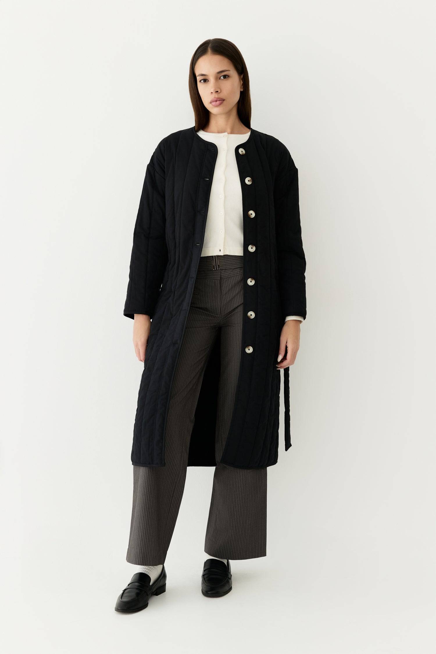 7964146401501, The Cary Coat, Outerwear, All Row, All Row,allrow,Back Detail,cf-color-black,cf-color-cream,cf-size-l,cf-size-m,cf-size-s,cf-vendor-all-row,Coat,Cotton,Cream,Detail,final-sale,finalsale,minimalist,new,Oversized,sale,statement,statement piece,tencel,Womens,womens top, Information Your winter wardrobe won't be complete without this long quilted coat. The Cary Coat is made in an oversized fit and features a classic rounded neckline, a button front closure, patch pockets, an easy below-the-knee l