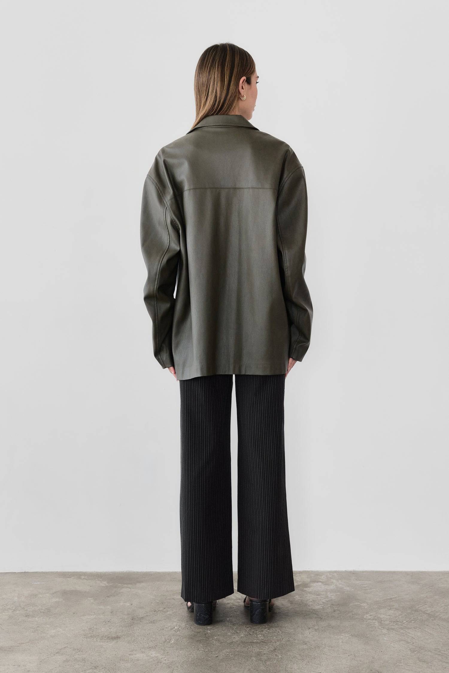 7964139290845, The Camren Jacket, Outerwear, All Row, All Row,allrow,Back Detail,cf-color-black,cf-color-olive,cf-size-l,cf-vendor-all-row,Coat,common,common market,Cotton,Detail,Faux Leather,genderless,Leather,mens,mens shirt,minimalist,new,Olive,Oversized,Pleather,Polyester,Semi-Formal,Spring,statement,statement piece,tencel,Unisex,vegan leather,versatile,Womens,womens top, Information The Camren Jacket is a unisex faux leather jacket in a boxy silhouette. It features a back yoke, side patch pockets, and