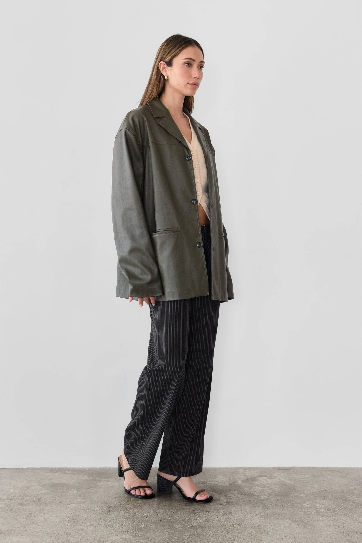 7964139290845, The Camren Jacket, Outerwear, All Row, All Row,allrow,Back Detail,cf-color-black,cf-color-olive,cf-size-l,cf-vendor-all-row,Coat,common,common market,Cotton,Detail,Faux Leather,genderless,Leather,mens,mens shirt,minimalist,new,Olive,Oversized,Pleather,Polyester,Semi-Formal,Spring,statement,statement piece,tencel,Unisex,vegan leather,versatile,Womens,womens top, Information The Camren Jacket is a unisex faux leather jacket in a boxy silhouette. It features a back yoke, side patch pockets, and