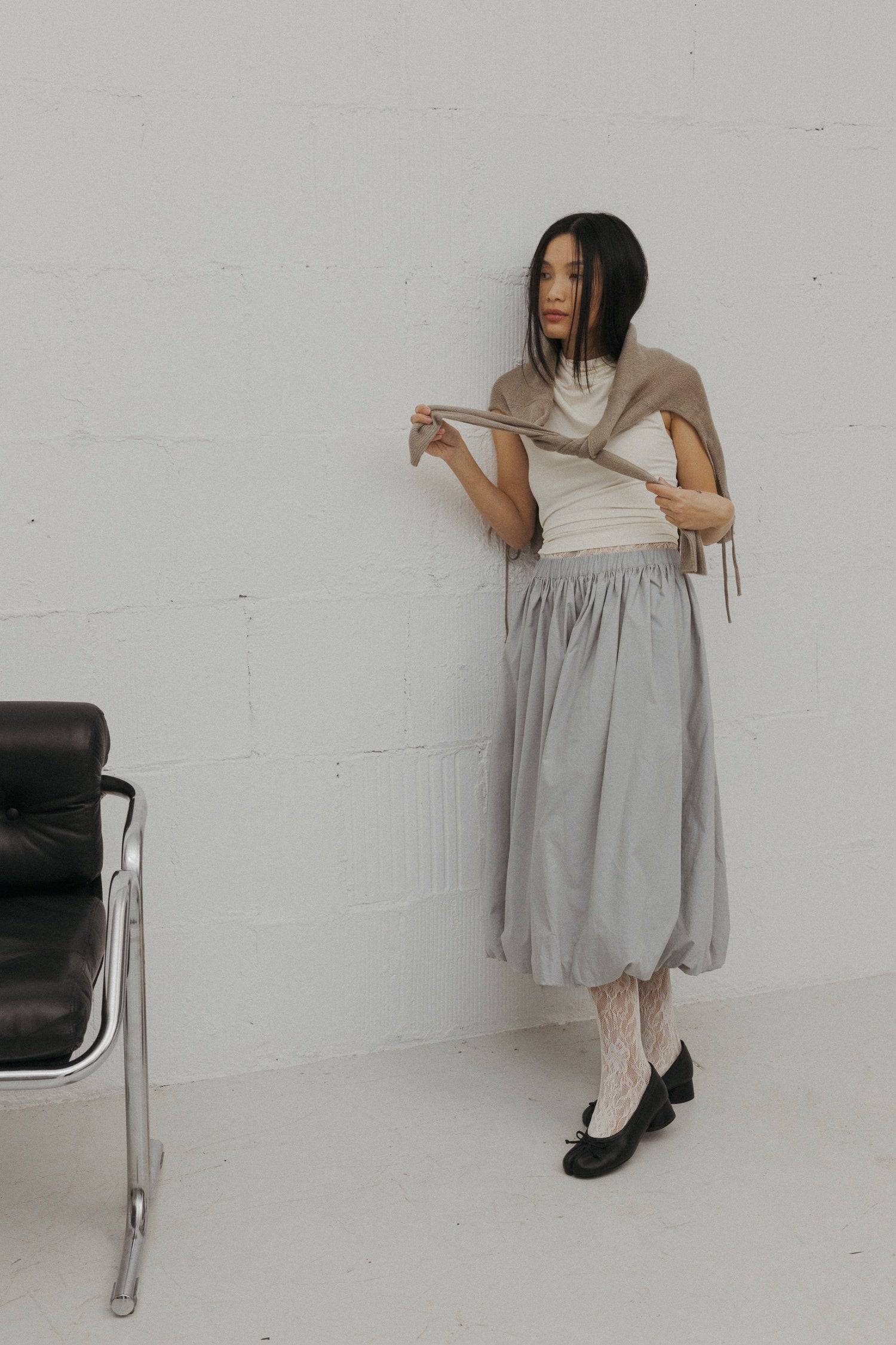 8466464997597, The Bella Skirt, Skirt, All Row, Black,Blue,Bottom,Bottoms,bubble,bubble skirt,cf-color-black,cf-color-natural,cf-size-l,cf-size-m,cf-size-s,Comfortable,Elastic,Elastic Waistband,everyday,flowy,ivory,Light Blue,matching,Midi Skirt,Mod Ref,Skirt,skirts,spring,Summer,womens, Information The Bella Skirt is a playful midi-length bubble skirt. It features an elasticated waist for a comfortable and adjustable fit. The length and bubble effect hem add volume and movement to the silhouette. Pair this