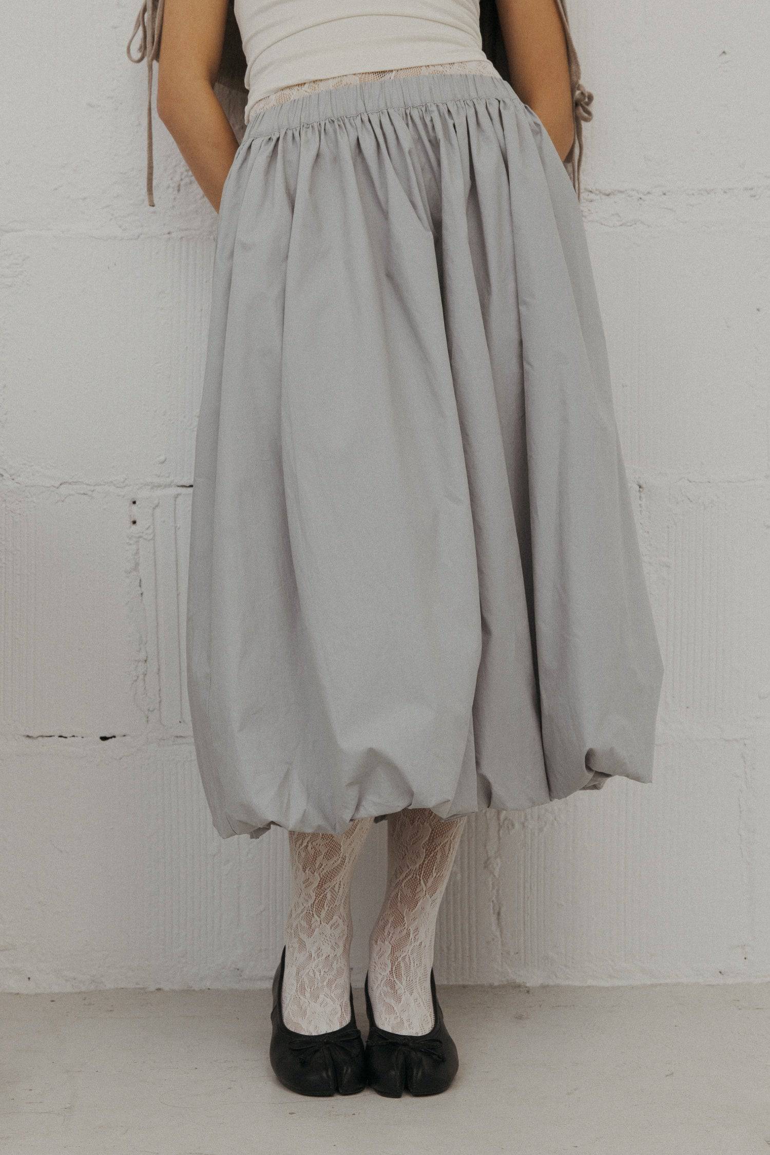 8466464997597, The Bella Skirt, Skirt, All Row, Black,Blue,Bottom,Bottoms,bubble,bubble skirt,cf-color-black,cf-color-natural,cf-size-l,cf-size-m,cf-size-s,Comfortable,Elastic,Elastic Waistband,everyday,flowy,ivory,Light Blue,matching,Midi Skirt,Mod Ref,Skirt,skirts,spring,Summer,womens, Information The Bella Skirt is a playful midi-length bubble skirt. It features an elasticated waist for a comfortable and adjustable fit. The length and bubble effect hem add volume and movement to the silhouette. Pair this