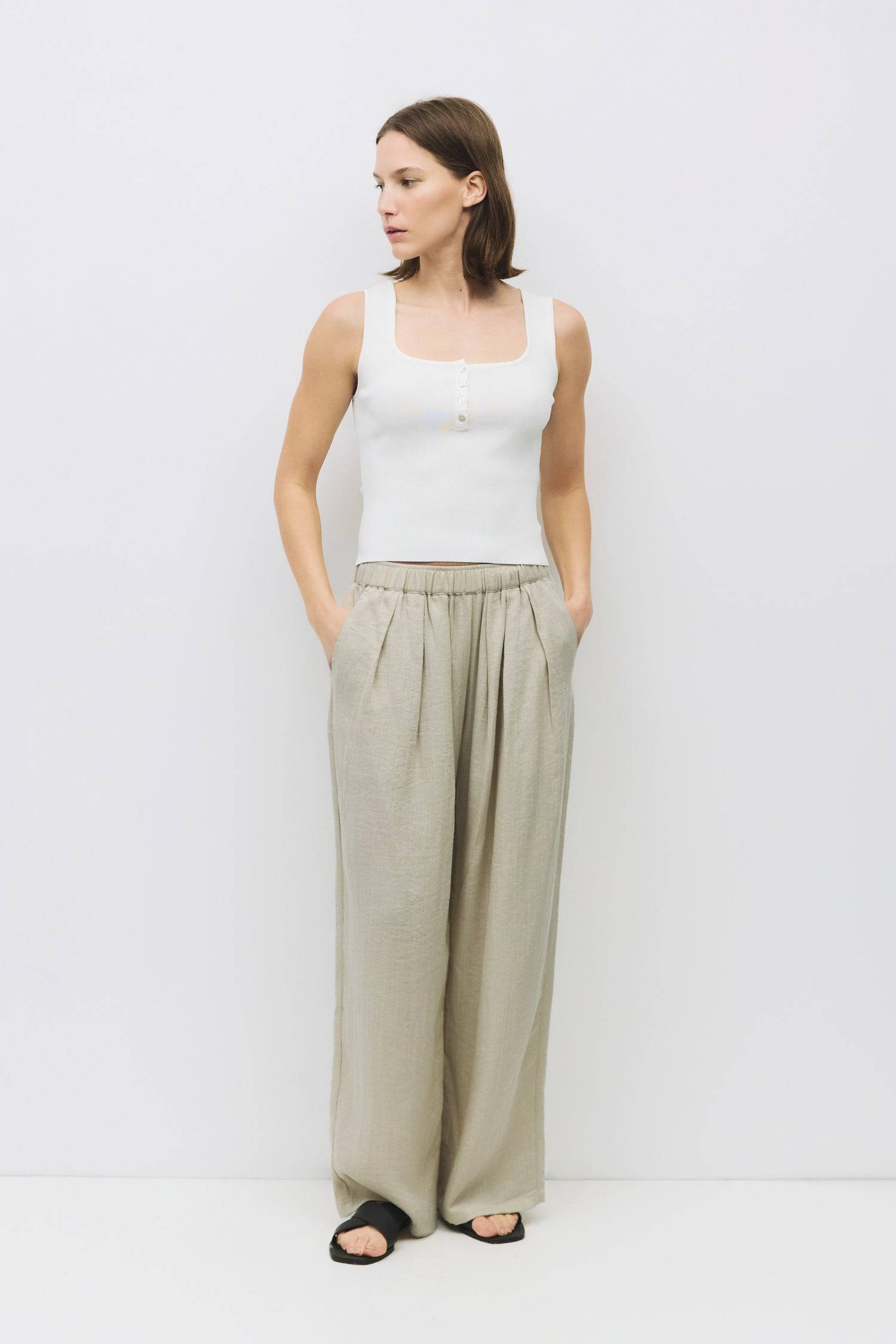 8929245593821, The Kerrigan Top, Tops, All Row, All Row,allrow,Basic,Basics,beige,Casual,cf-color-beige,cf-size-l,cf-size-m,cf-size-s,cf-vendor-all-row,Comfortable,Everyday,final-sale,finalsale,ivory,knit,Knit Top,Long Sleeve,Long Sleeve Top,Lounge,Loungewear,new,sale,Sleevless,Spring,Summer,tank,thin,Women's,womens top, Information The Kerrigan Top is a simple sleeveless tank featuring a square neckline and a partial button-down front for a touch of flair. Made from a soft ribbed knit fabric, this top is p