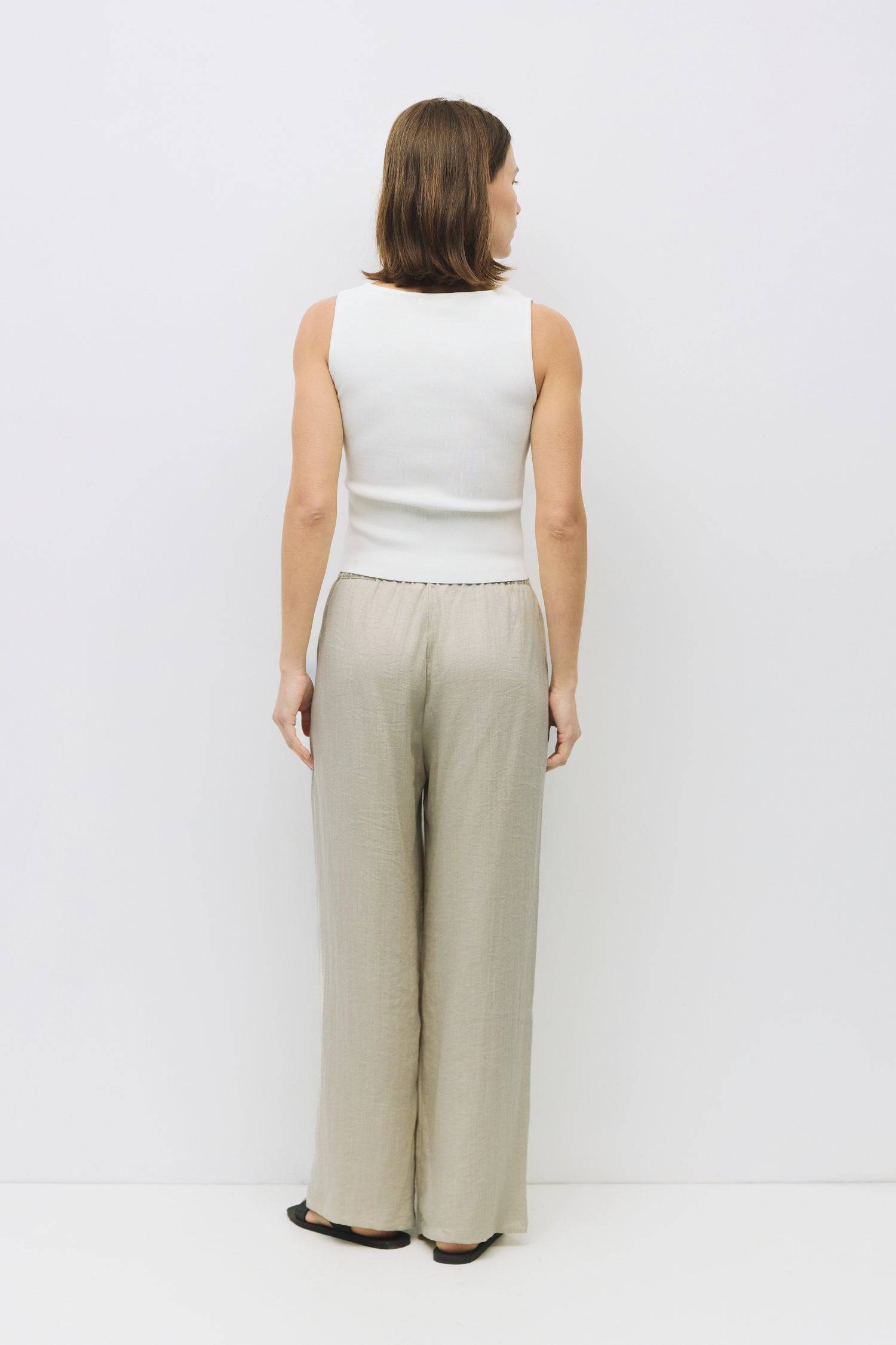 8929245593821, The Kerrigan Top, Tops, All Row, All Row,allrow,Basic,Basics,beige,Casual,cf-color-beige,cf-size-l,cf-size-m,cf-size-s,cf-vendor-all-row,Comfortable,Everyday,final-sale,finalsale,ivory,knit,Knit Top,Long Sleeve,Long Sleeve Top,Lounge,Loungewear,new,sale,Sleevless,Spring,Summer,tank,thin,Women's,womens top, Information The Kerrigan Top is a simple sleeveless tank featuring a square neckline and a partial button-down front for a touch of flair. Made from a soft ribbed knit fabric, this top is p