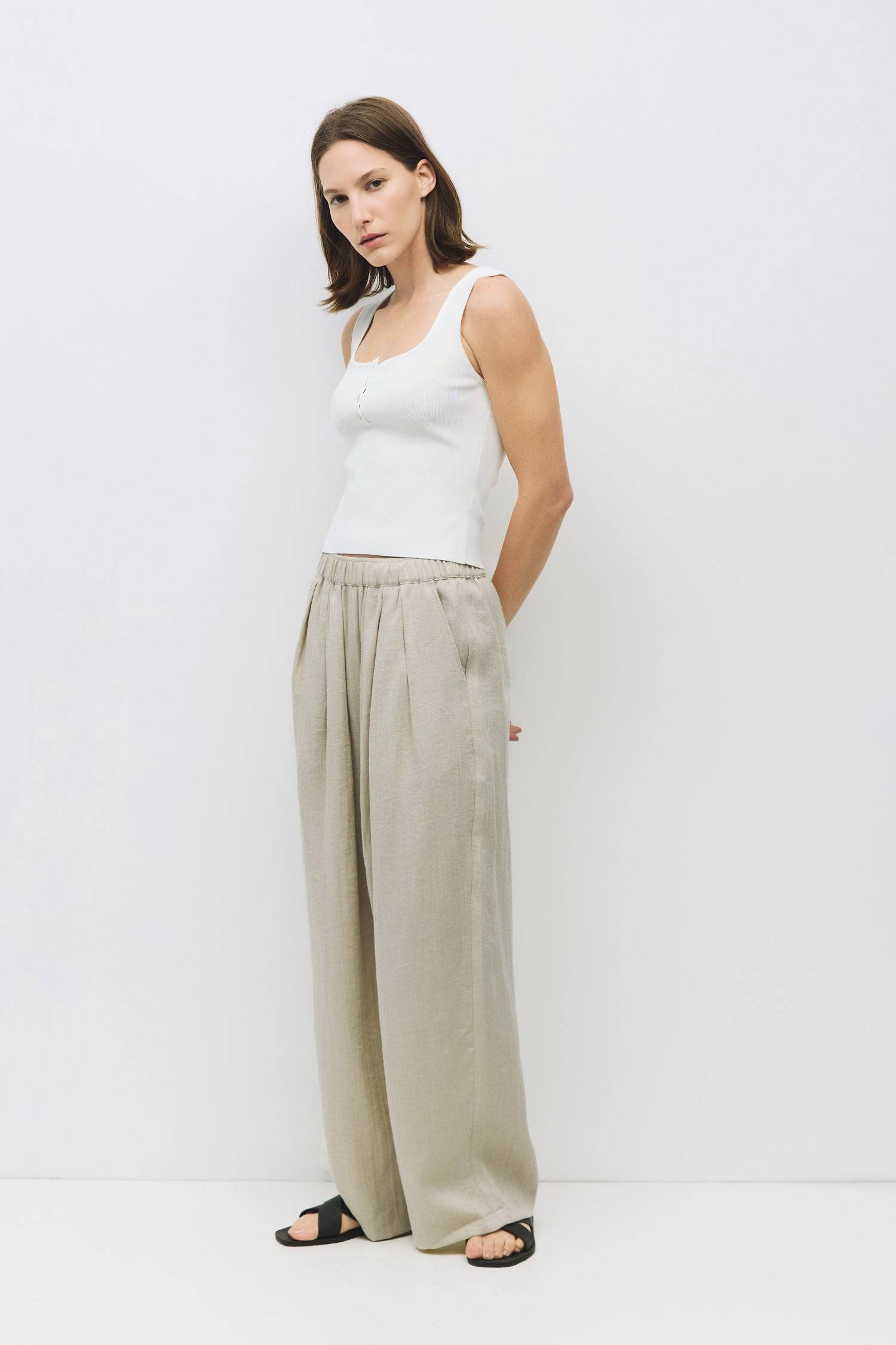 8929245593821, The Kerrigan Top, Tops, All Row, All Row,allrow,Basic,Basics,beige,Casual,cf-color-beige,cf-size-l,cf-size-m,cf-size-s,cf-vendor-all-row,Comfortable,Everyday,final-sale,finalsale,ivory,knit,Knit Top,Long Sleeve,Long Sleeve Top,Lounge,Loungewear,new,sale,Sleevless,Spring,Summer,tank,thin,Women's,womens top, Information The Kerrigan Top is a simple sleeveless tank featuring a square neckline and a partial button-down front for a touch of flair. Made from a soft ribbed knit fabric, this top is p