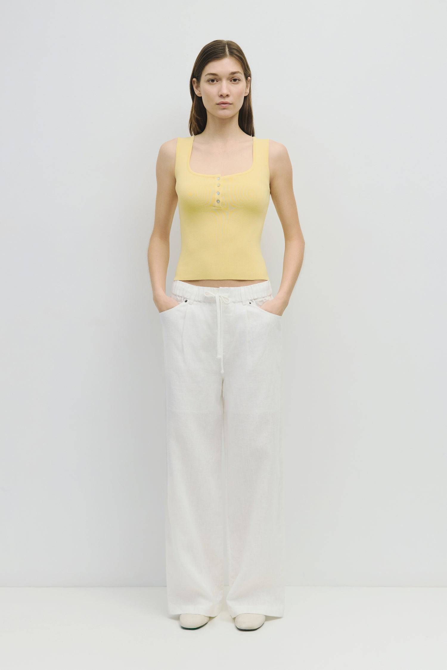 8929245593821, The Kerrigan Top, Tops, All Row, All Row,allrow,Basic,Basics,beige,Casual,cf-color-beige,cf-size-l,cf-size-m,cf-size-s,cf-vendor-all-row,Comfortable,Everyday,final-sale,finalsale,ivory,knit,Knit Top,Long Sleeve,Long Sleeve Top,Lounge,Loungewear,new,sale,Sleevless,Spring,Summer,tank,thin,Women's,womens top, Information The Kerrigan Top is a simple sleeveless tank featuring a square neckline and a partial button-down front for a touch of flair. Made from a soft ribbed knit fabric, this top is p