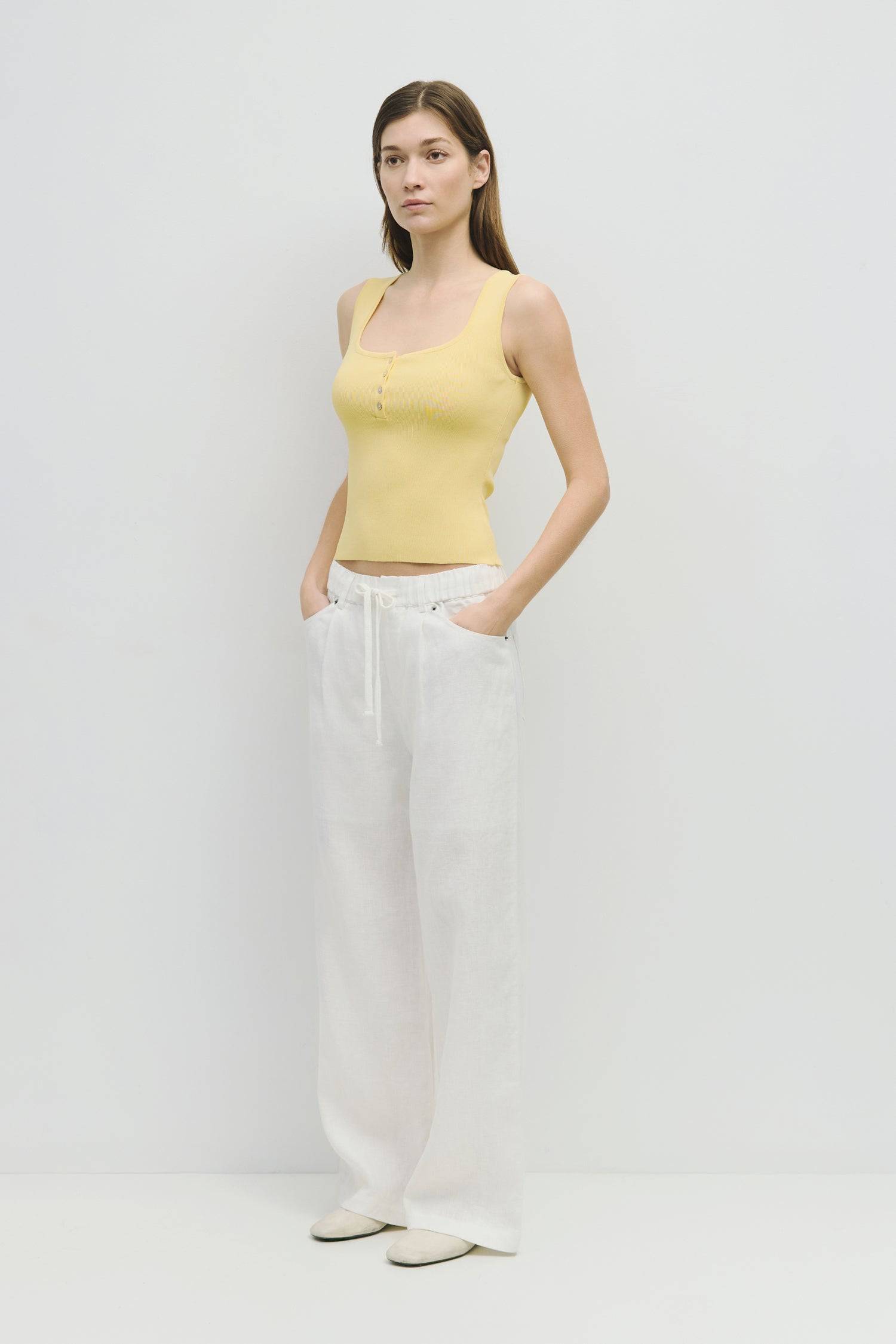 8929245593821, The Kerrigan Top, Tops, All Row, All Row,allrow,Basic,Basics,beige,Casual,cf-color-beige,cf-size-l,cf-size-m,cf-size-s,cf-vendor-all-row,Comfortable,Everyday,final-sale,finalsale,ivory,knit,Knit Top,Long Sleeve,Long Sleeve Top,Lounge,Loungewear,new,sale,Sleevless,Spring,Summer,tank,thin,Women's,womens top, Information The Kerrigan Top is a simple sleeveless tank featuring a square neckline and a partial button-down front for a touch of flair. Made from a soft ribbed knit fabric, this top is p