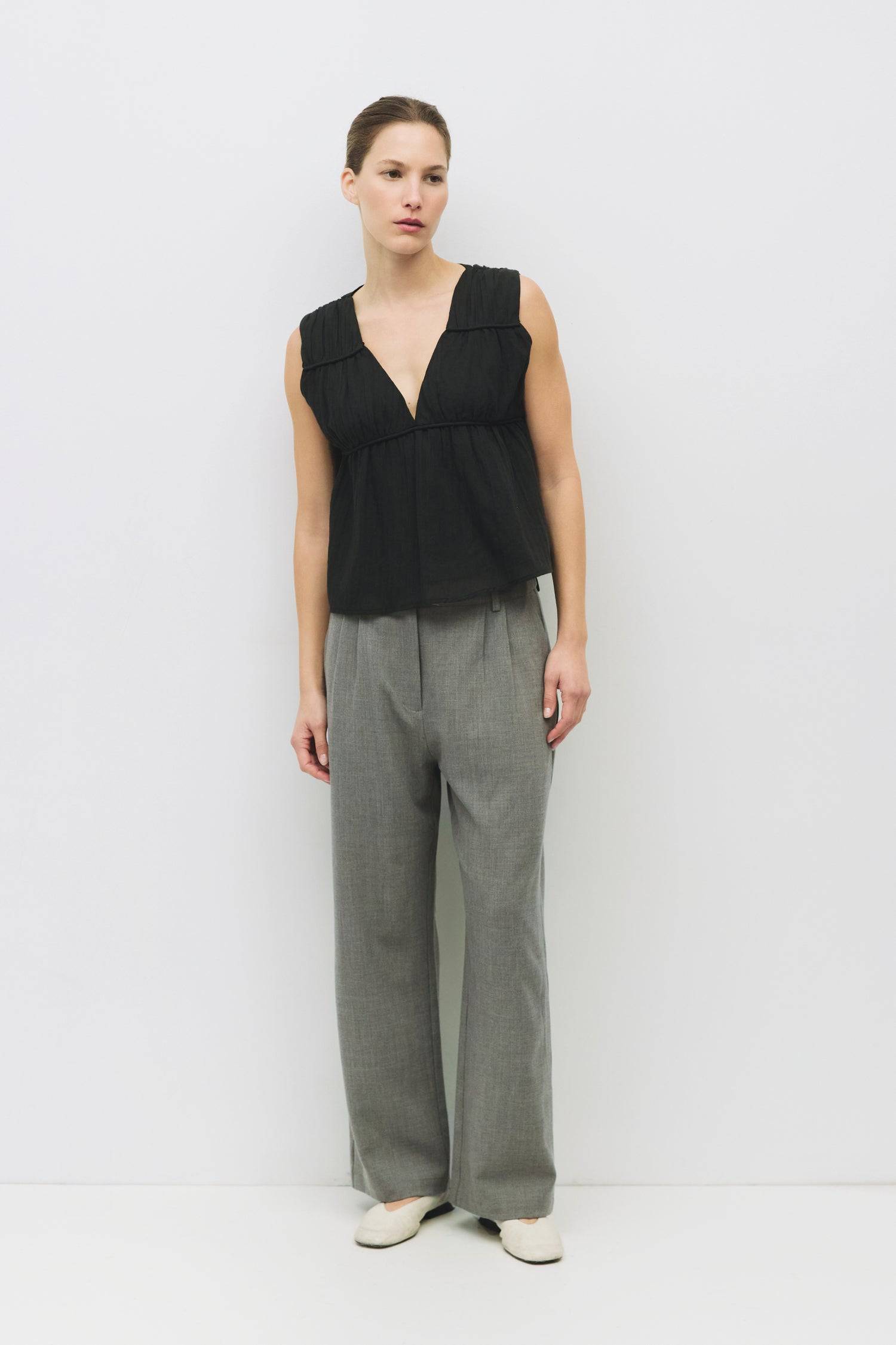 9045682553053, The Cora Top, Tops, Mod Ref, Basic,Basics,Black,boat neck,Casual,cf-color-black,cf-size-l,cf-size-m,cf-size-s,cf-vendor-mod-ref,Comfortable,Everyday,panel,Ribbed Top,Sleeveless,Spring,Summer,Tee,Tops,Transitional,V Neckline,white,Women's,womens top, Information The Cora Top is a sleeveless blouse with paneled shirring that creates a flattering silhouette. Its v-neckline adds a touch of elegance and effortlessly pairs with a midi skirt or high-waisted bottoms. Details 100% Cotton Gathered V Ne