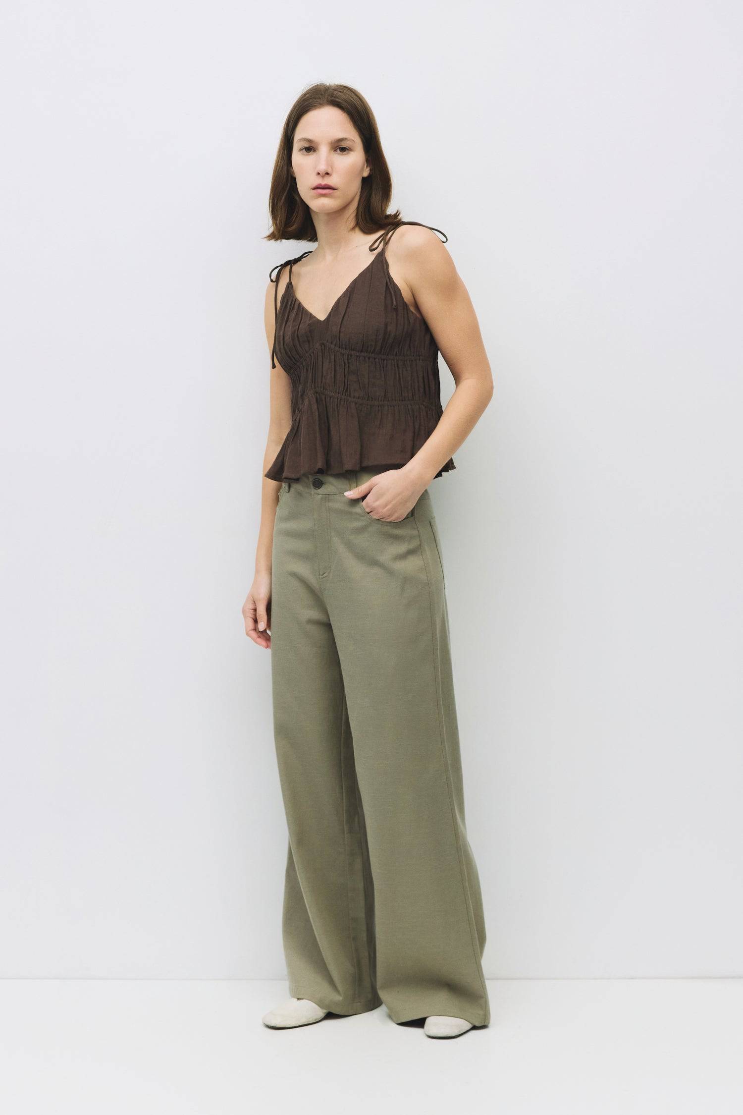 8954057785565, The Kendra Top, Tops, All Row, adjustable,adjustable ties,Black,brown,Casual,cf-color-brown,cf-color-cream,cf-color-olive,cf-size-l,cf-size-m,cf-size-s,cf-size-xl,cf-vendor-all-row,Comfortable,Cream,Crew Neckline,Everyday,final-sale,finalsale,flowy,Front Tie,Layers,Lightweight,Minimal,new,Relaxed,Relaxed Fit,sale,Soft,Spring,Top,Trendy,Women's, Information The Kendra Top is a chic, gathered slip-style cropped tank featuring adjustable shoulder ties and textured columned shirring for a flatter