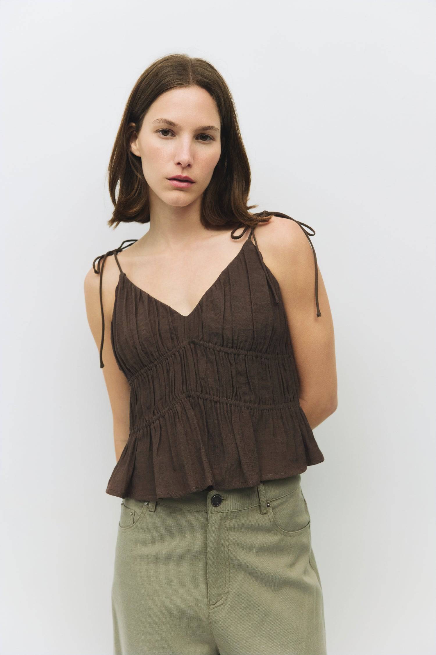 8954057785565, The Kendra Top, Tops, All Row, adjustable,adjustable ties,Black,brown,Casual,cf-color-brown,cf-color-cream,cf-color-olive,cf-size-l,cf-size-m,cf-size-s,cf-size-xl,cf-vendor-all-row,Comfortable,Cream,Crew Neckline,Everyday,final-sale,finalsale,flowy,Front Tie,Layers,Lightweight,Minimal,new,Relaxed,Relaxed Fit,sale,Soft,Spring,Top,Trendy,Women's, Information The Kendra Top is a chic, gathered slip-style cropped tank featuring adjustable shoulder ties and textured columned shirring for a flatter