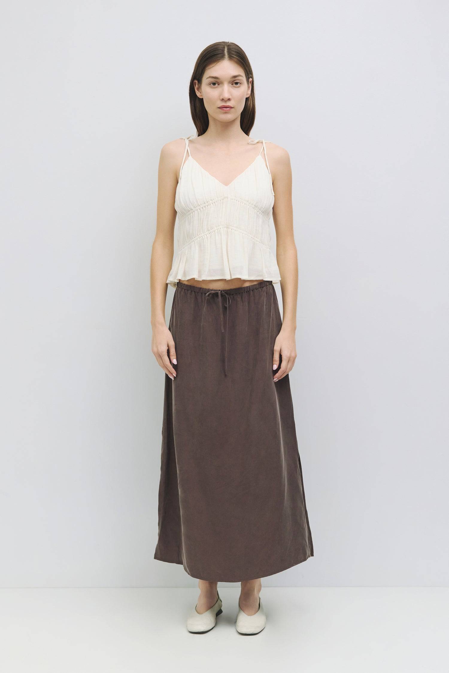 8954057785565, The Kendra Top, Tops, All Row, adjustable,adjustable ties,Black,brown,Casual,cf-color-brown,cf-color-cream,cf-color-olive,cf-size-l,cf-size-m,cf-size-s,cf-size-xl,cf-vendor-all-row,Comfortable,Cream,Crew Neckline,Everyday,final-sale,finalsale,flowy,Front Tie,Layers,Lightweight,Minimal,new,Relaxed,Relaxed Fit,sale,Soft,Spring,Top,Trendy,Women's, Information The Kendra Top is a chic, gathered slip-style cropped tank featuring adjustable shoulder ties and textured columned shirring for a flatter