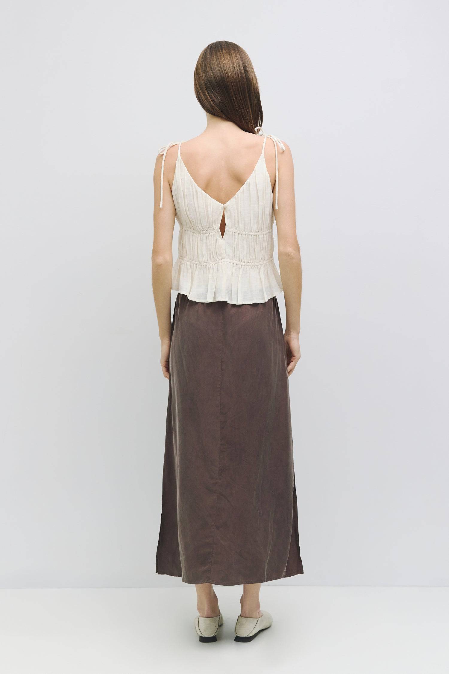 8954057785565, The Kendra Top, Tops, All Row, adjustable,adjustable ties,Black,brown,Casual,cf-color-brown,cf-color-cream,cf-color-olive,cf-size-l,cf-size-m,cf-size-s,cf-size-xl,cf-vendor-all-row,Comfortable,Cream,Crew Neckline,Everyday,final-sale,finalsale,flowy,Front Tie,Layers,Lightweight,Minimal,new,Relaxed,Relaxed Fit,sale,Soft,Spring,Top,Trendy,Women's, Information The Kendra Top is a chic, gathered slip-style cropped tank featuring adjustable shoulder ties and textured columned shirring for a flatter