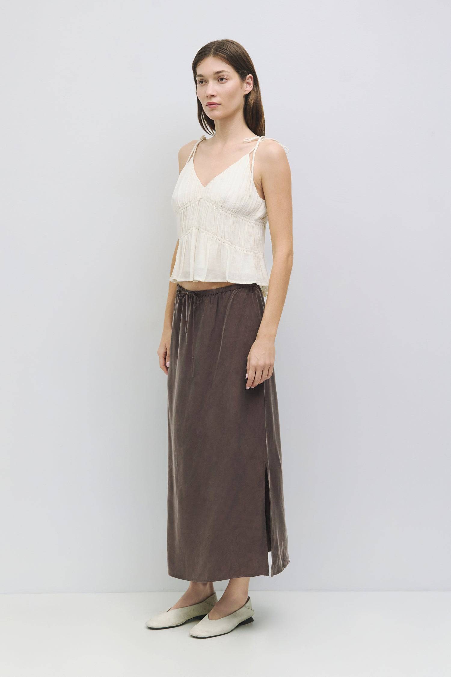 8954057785565, The Kendra Top, Tops, All Row, adjustable,adjustable ties,Black,brown,Casual,cf-color-brown,cf-color-cream,cf-color-olive,cf-size-l,cf-size-m,cf-size-s,cf-size-xl,cf-vendor-all-row,Comfortable,Cream,Crew Neckline,Everyday,final-sale,finalsale,flowy,Front Tie,Layers,Lightweight,Minimal,new,Relaxed,Relaxed Fit,sale,Soft,Spring,Top,Trendy,Women's, Information The Kendra Top is a chic, gathered slip-style cropped tank featuring adjustable shoulder ties and textured columned shirring for a flatter