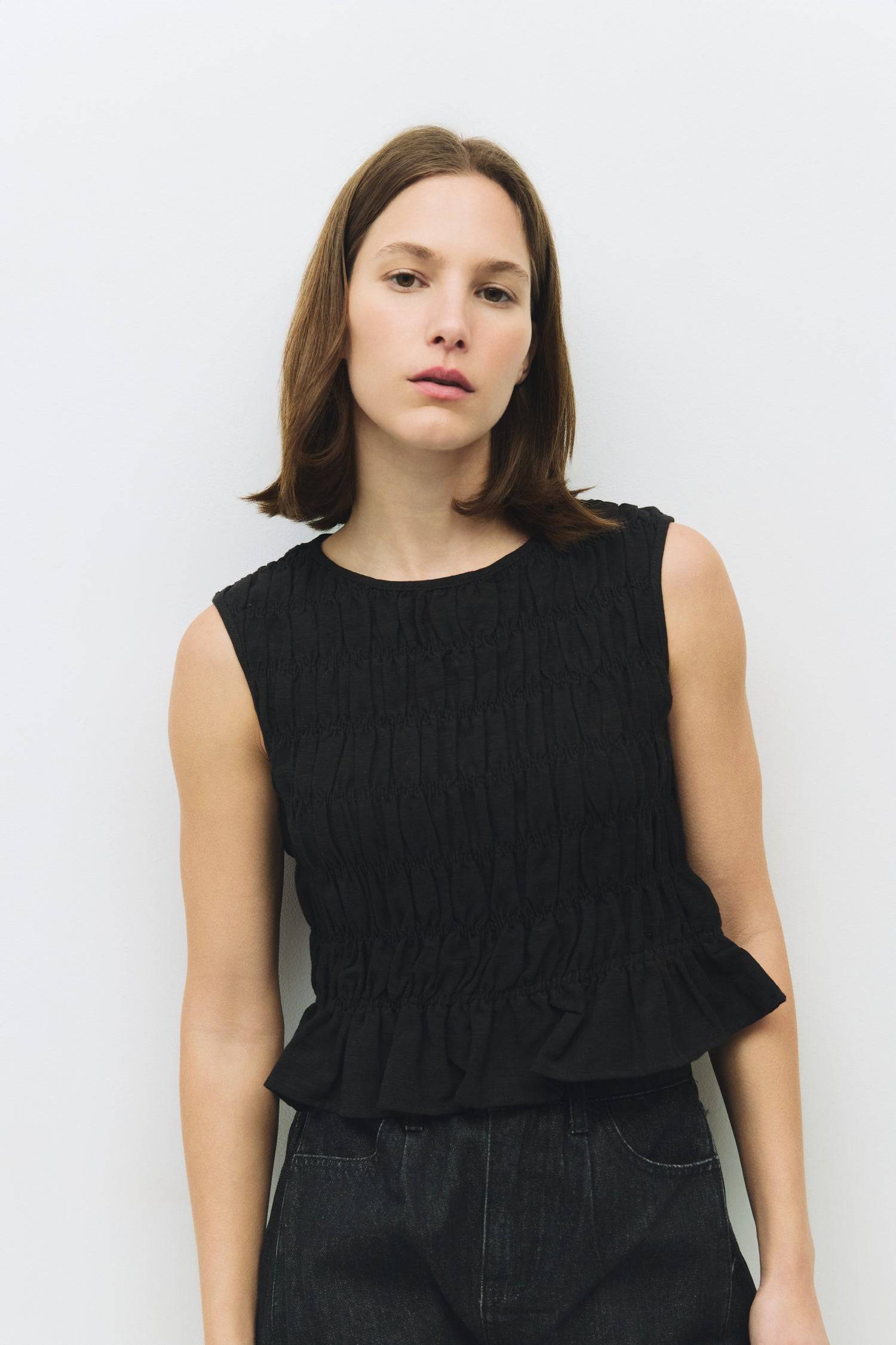 8954058146013, The Florencia Top, Tops, All Row, All Row,allrow,Black,Casual,cf-color-black,cf-color-white,cf-color-yellow,cf-size-l,cf-size-m,cf-size-s,cf-vendor-all-row,cinched,final-sale,finalsale,new,Red,Ruffles,sale,set,Sets,Spring,Summer,texture,white,Women's,womens top, Information The Florencia Top is a sleeveless smocked linen piece with a high neck and a keyhole back with a button closure. Its smocked front and back, plus a playful bottom ruffle, create a relaxed, cropped fit that’s perfect for th