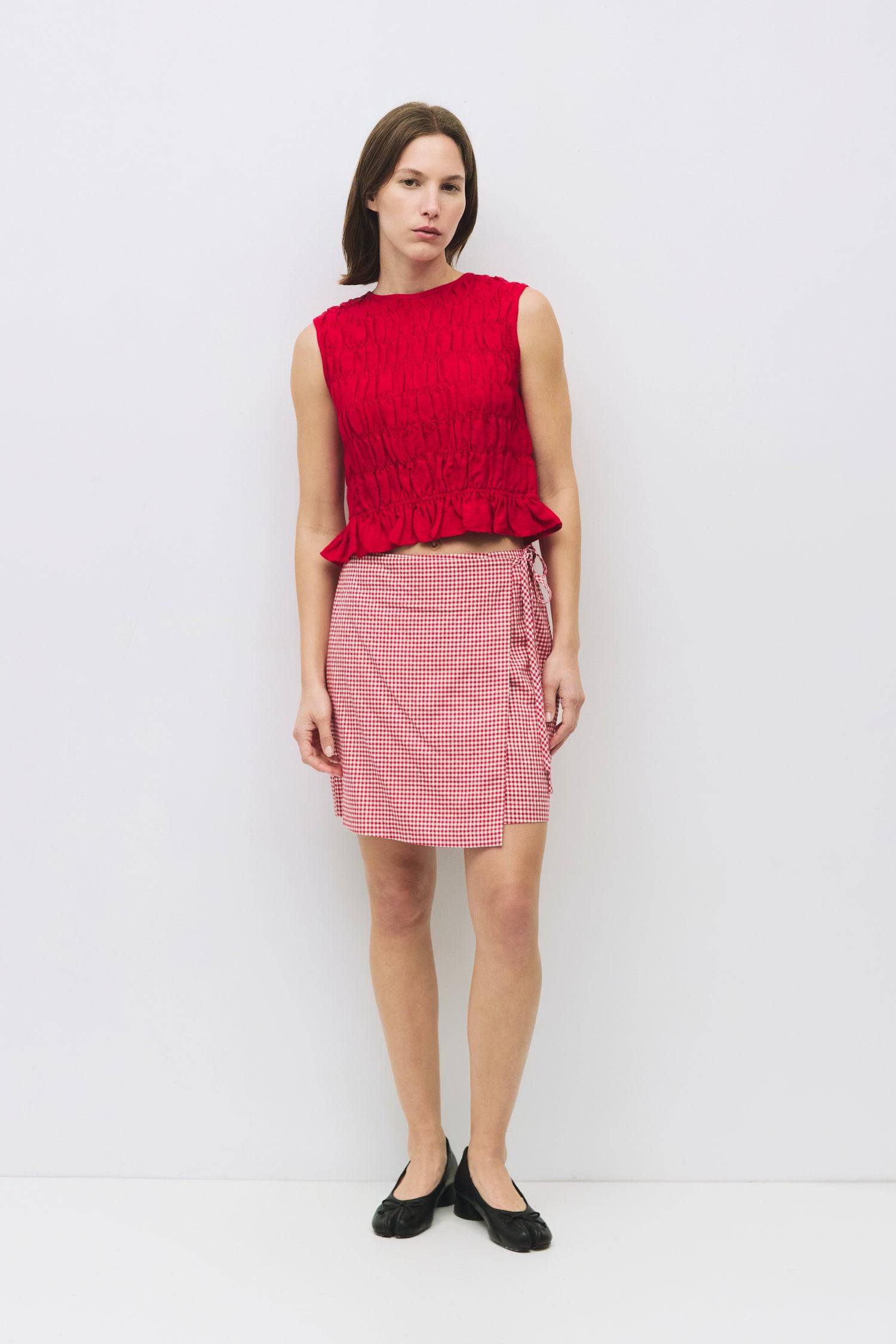 8954058146013, The Florencia Top, Tops, All Row, All Row,allrow,Black,Casual,cf-color-black,cf-color-white,cf-color-yellow,cf-size-l,cf-size-m,cf-size-s,cf-vendor-all-row,cinched,final-sale,finalsale,new,Red,Ruffles,sale,set,Sets,Spring,Summer,texture,white,Women's,womens top, Information The Florencia Top is a sleeveless smocked linen piece with a high neck and a keyhole back with a button closure. Its smocked front and back, plus a playful bottom ruffle, create a relaxed, cropped fit that’s perfect for th