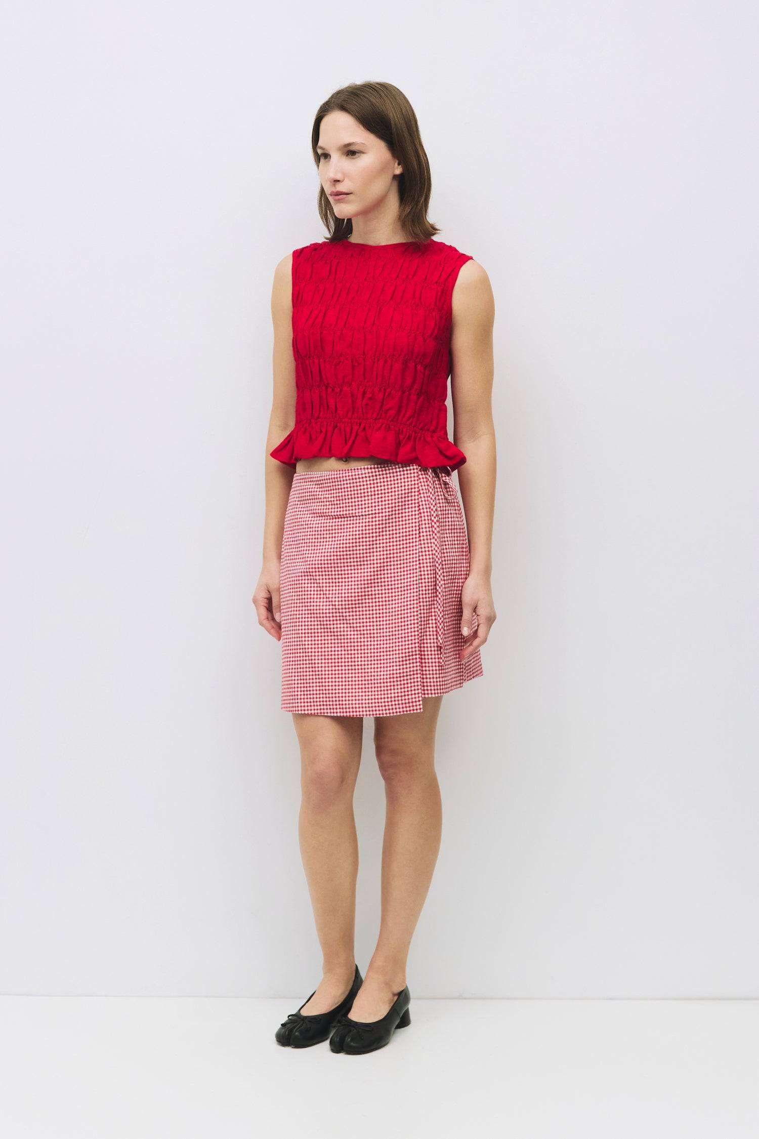 8954058146013, The Florencia Top, Tops, All Row, All Row,allrow,Black,Casual,cf-color-black,cf-color-white,cf-color-yellow,cf-size-l,cf-size-m,cf-size-s,cf-vendor-all-row,cinched,final-sale,finalsale,new,Red,Ruffles,sale,set,Sets,Spring,Summer,texture,white,Women's,womens top, Information The Florencia Top is a sleeveless smocked linen piece with a high neck and a keyhole back with a button closure. Its smocked front and back, plus a playful bottom ruffle, create a relaxed, cropped fit that’s perfect for th