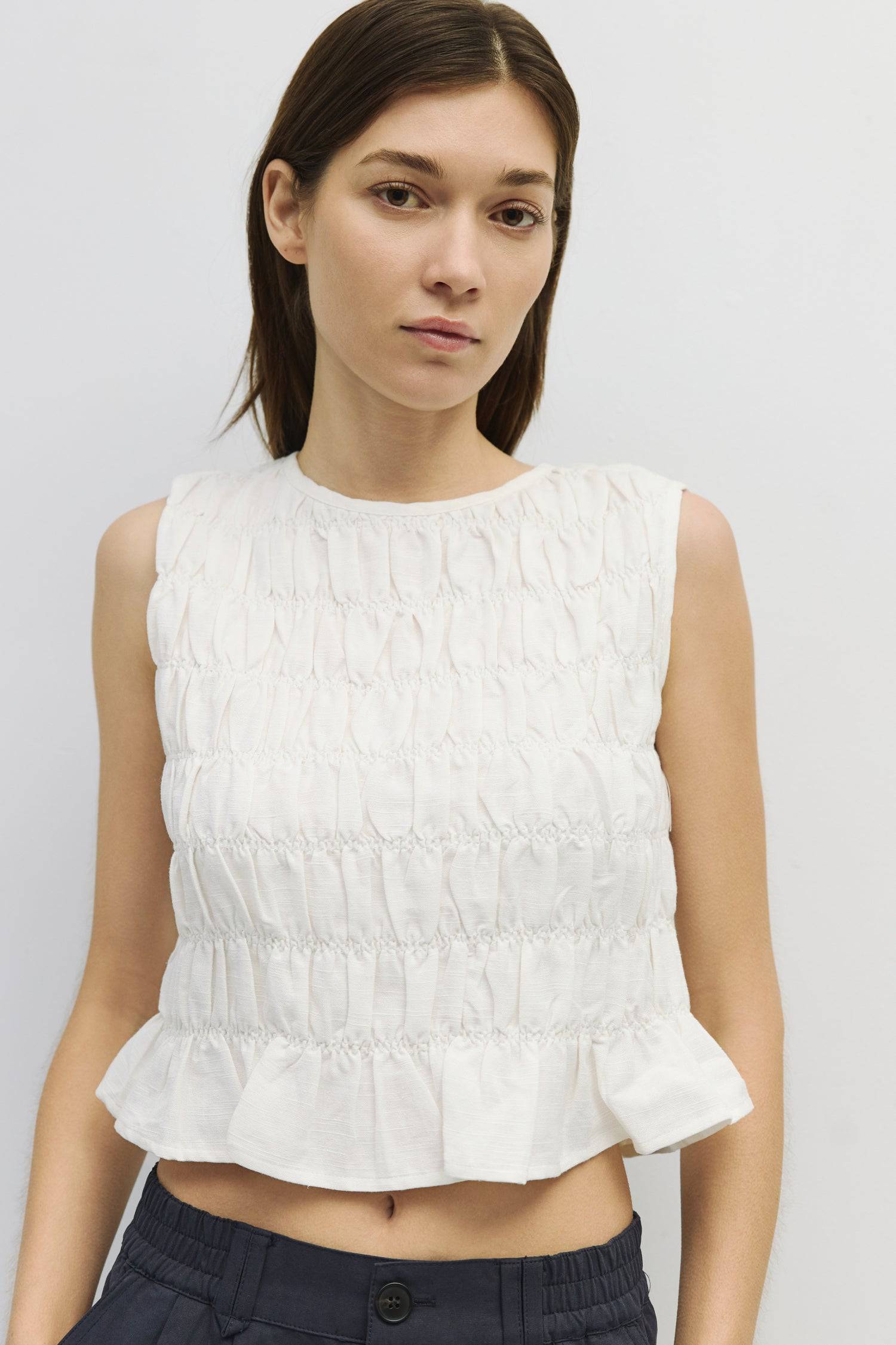 8954058146013, The Florencia Top, Tops, All Row, All Row,allrow,Black,Casual,cf-color-black,cf-color-white,cf-color-yellow,cf-size-l,cf-size-m,cf-size-s,cf-vendor-all-row,cinched,final-sale,finalsale,new,Red,Ruffles,sale,set,Sets,Spring,Summer,texture,white,Women's,womens top, Information The Florencia Top is a sleeveless smocked linen piece with a high neck and a keyhole back with a button closure. Its smocked front and back, plus a playful bottom ruffle, create a relaxed, cropped fit that’s perfect for th