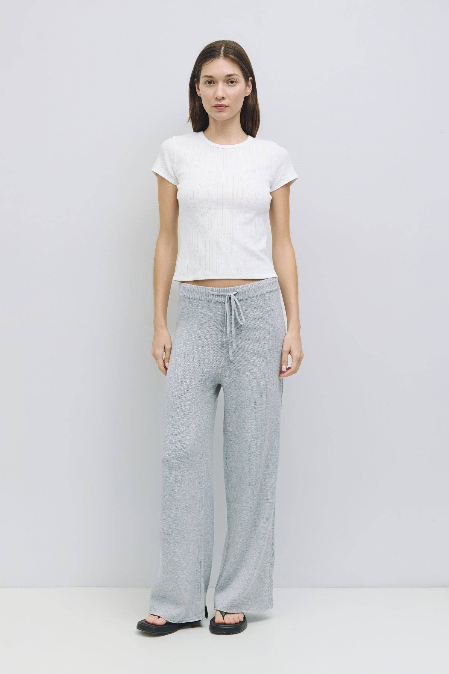 8929243955421, The Deborah Top, Tops, All Row, 90s,Basic,Basics,Black,Blue,Casual,cf-color-blue,cf-color-sage,cf-color-white,cf-size-l,cf-size-m,cf-size-s,cf-vendor-mod-ref,Comfortable,Crew Neck,Crew Neckline,Everyday,final-sale,finalsale,Form Fitting,pointelle,Ribbed,Ribbed Fabric,Ribbed Top,Sage,sale,Short Sleeve,Spring,stretch,Stretchy,Summer,Tee,Tops,Transitional,white,Women's, Information The Deborah Top is a fitted baby tee made from soft pointelle knit fabric, featuring a classic crew neck and short