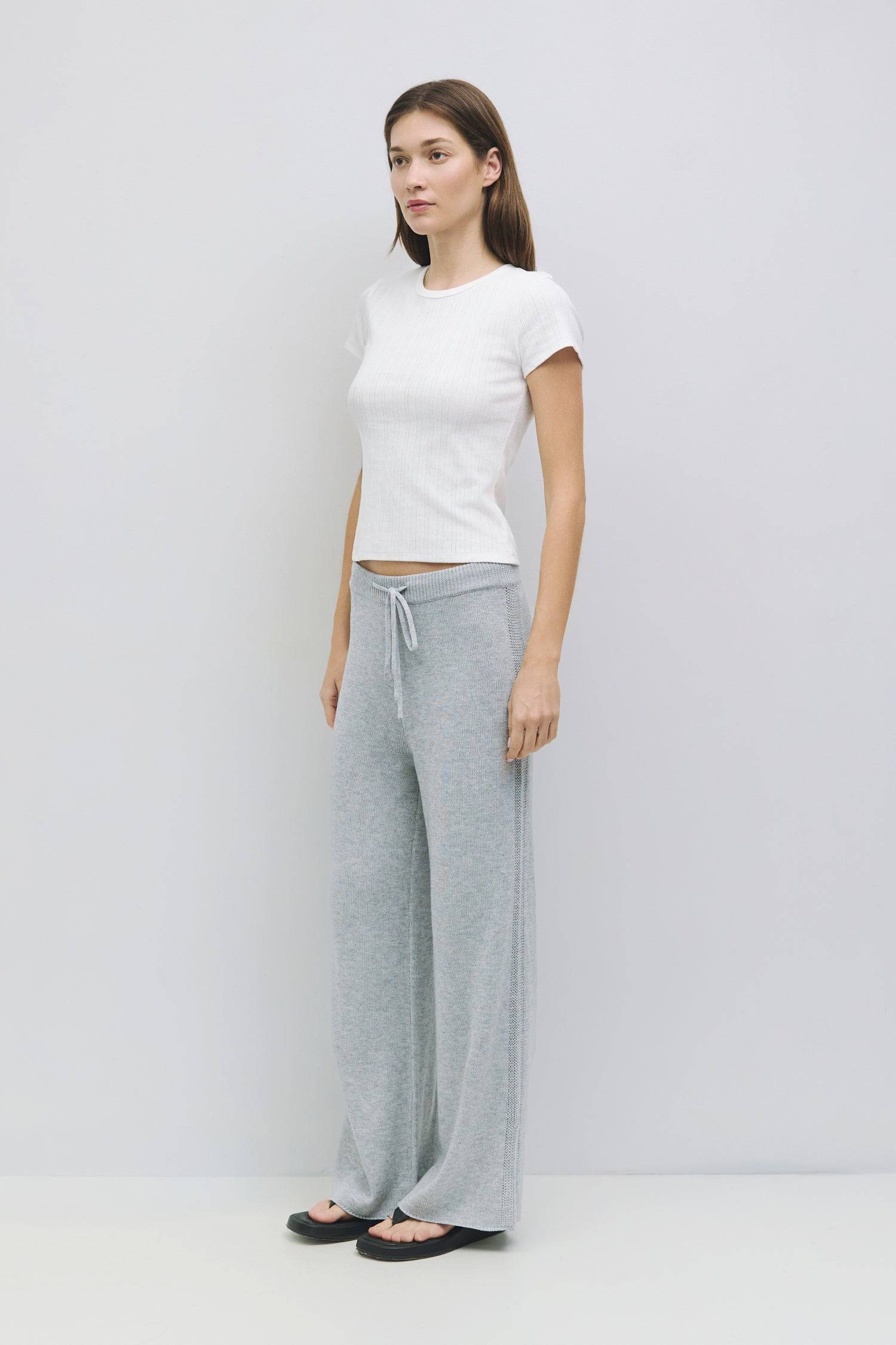 8929243955421, The Deborah Top, Tops, All Row, 90s,Basic,Basics,Black,Blue,Casual,cf-color-blue,cf-color-sage,cf-color-white,cf-size-l,cf-size-m,cf-size-s,cf-vendor-mod-ref,Comfortable,Crew Neck,Crew Neckline,Everyday,final-sale,finalsale,Form Fitting,pointelle,Ribbed,Ribbed Fabric,Ribbed Top,Sage,sale,Short Sleeve,Spring,stretch,Stretchy,Summer,Tee,Tops,Transitional,white,Women's, Information The Deborah Top is a fitted baby tee made from soft pointelle knit fabric, featuring a classic crew neck and short