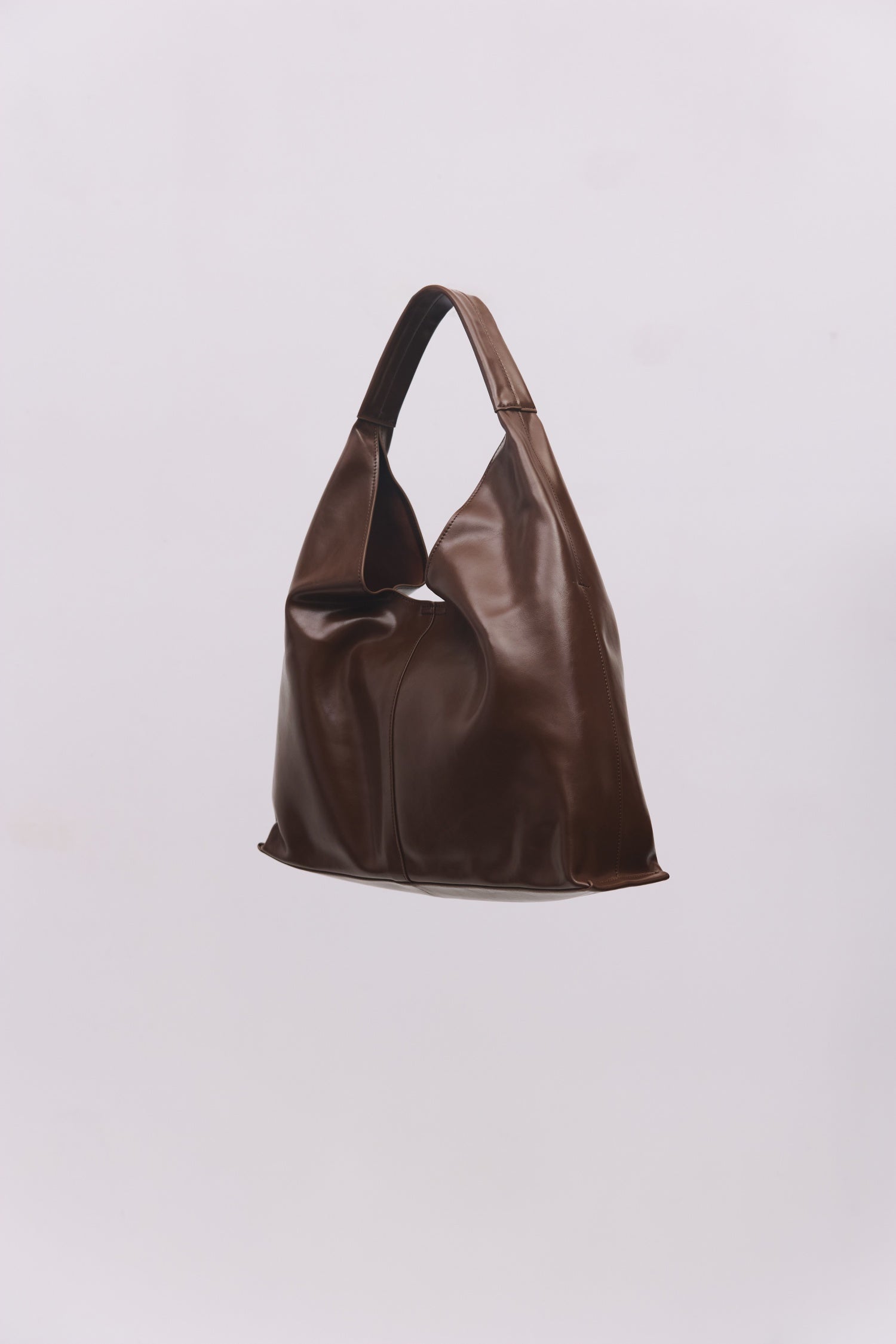 8989083599069, The Cosani Bag, Bags, Mod Ref | Common Market, accessories,bag,bags,cf-color-khaki,cf-color-white,cf-vendor-mod-ref-common-market,dark brown,modrefcommonmarket,Oversized,purse, Information The Cosani Bag is a medium-sized, slouchy patent leather bindle bag with a front seam detail and integrated patent strap. Features a magnetic button closure, flat bottom for structure, and a removable makeup or coin purse for added convenience. Details 100% Cowhide Slouchy Shape Magnetic Button Closure Remo