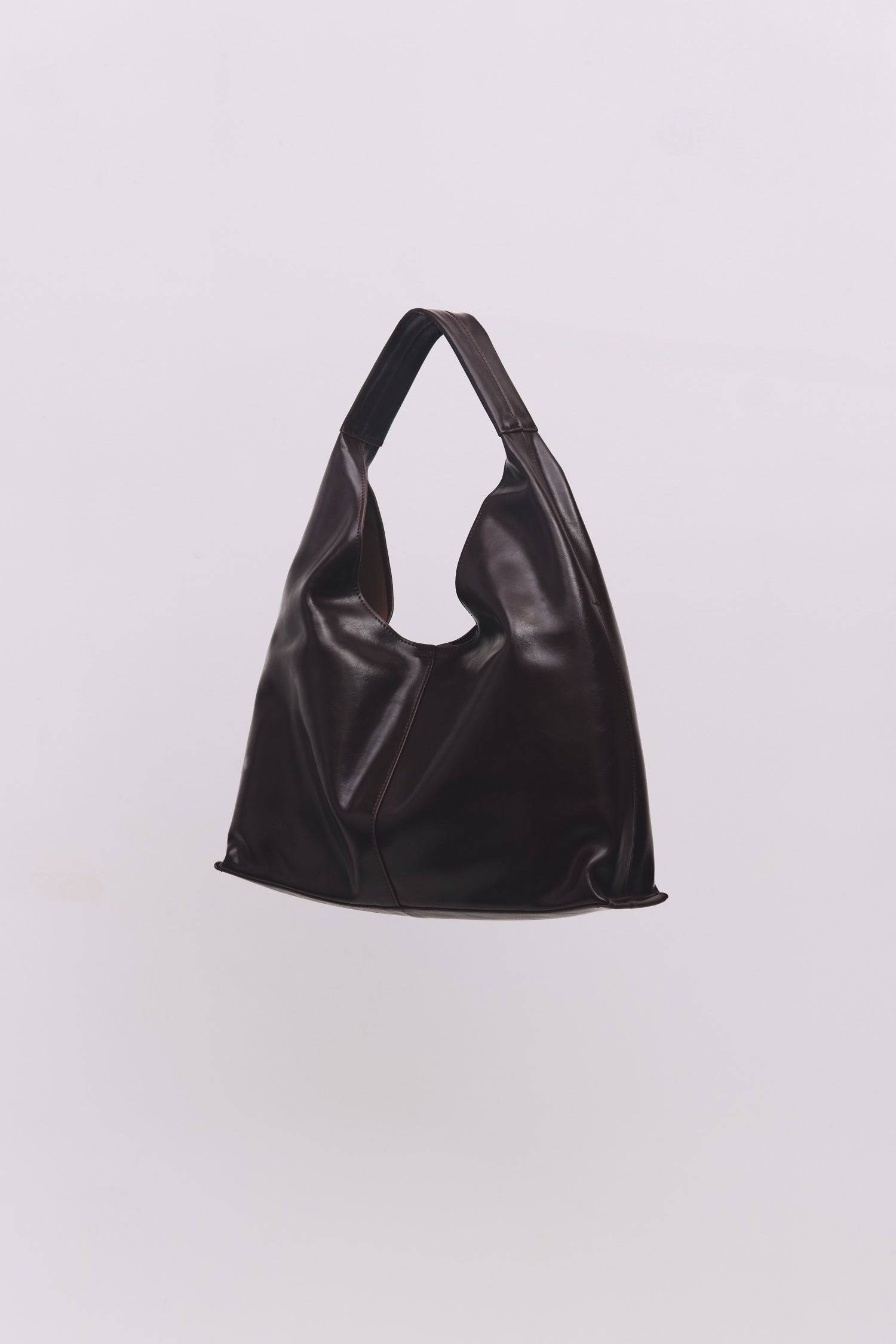 8989083599069, The Cosani Bag, Bags, Mod Ref | Common Market, accessories,bag,bags,cf-color-khaki,cf-color-white,cf-vendor-mod-ref-common-market,dark brown,modrefcommonmarket,Oversized,purse, Information The Cosani Bag is a medium-sized, slouchy patent leather bindle bag with a front seam detail and integrated patent strap. Features a magnetic button closure, flat bottom for structure, and a removable makeup or coin purse for added convenience. Details 100% Cowhide Slouchy Shape Magnetic Button Closure Remo