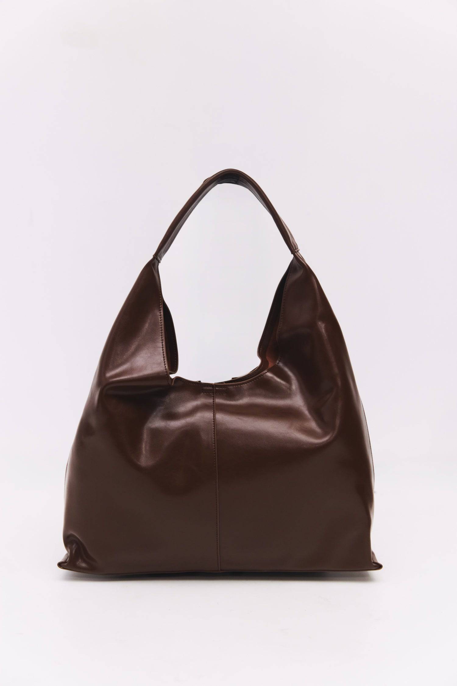 8989083599069, The Cosani Bag, Bags, Mod Ref | Common Market, accessories,bag,bags,cf-color-khaki,cf-color-white,cf-vendor-mod-ref-common-market,dark brown,modrefcommonmarket,Oversized,purse, Information The Cosani Bag is a medium-sized, slouchy patent leather bindle bag with a front seam detail and integrated patent strap. Features a magnetic button closure, flat bottom for structure, and a removable makeup or coin purse for added convenience. Details 100% Cowhide Slouchy Shape Magnetic Button Closure Remo