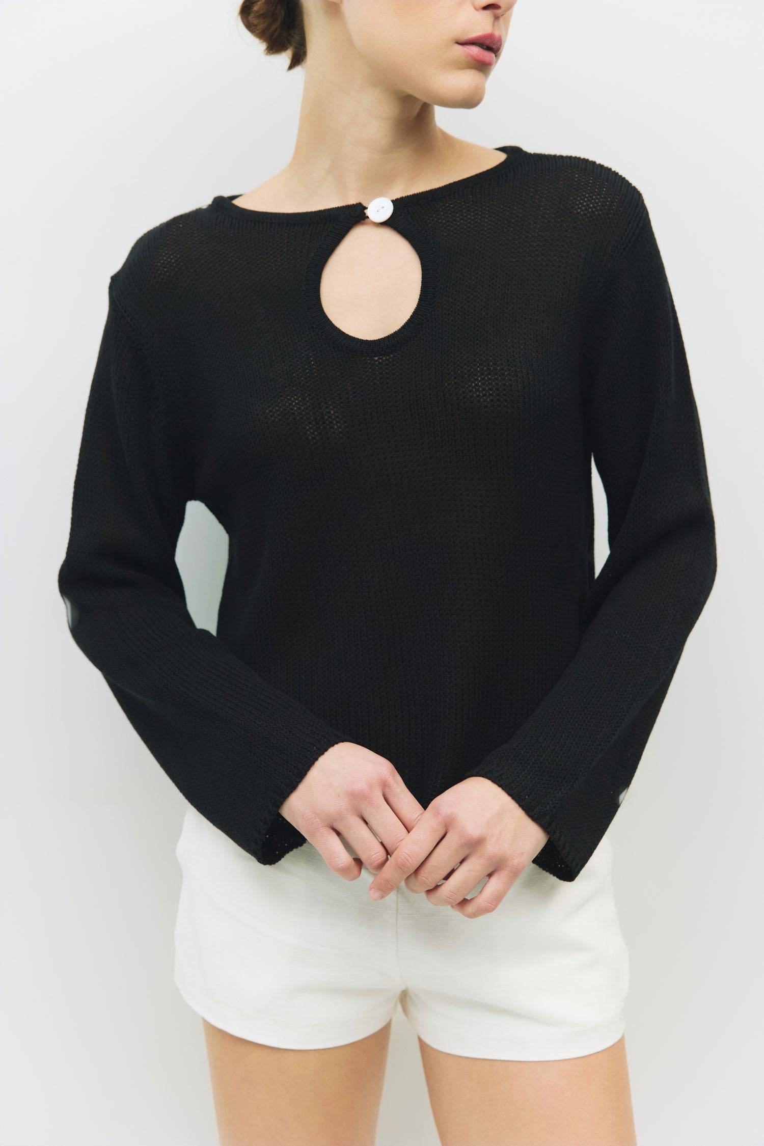 8929241989341, The Tala Sweater, Tops, All Row, All Row,allrow,Basic,Basics,Black,Blue,Cardigan,Casual,cf-color-black,cf-color-blue,cf-color-cream,cf-size-l,cf-size-m,cf-size-s,Comfortable,Cream,Crew Neck,Crop,Cropped,cropped hemline,Everyday,Grey,key hole,Light Blue,longsleeve,Matching Set,new,set,Sets,Shell Buttons,Short Sleeve,Spring,stretch,Transitional,Womens,womens top, Information The Tala Sweater is a comfy long-sleeve piece featuring a unique front cut-out with a button closure for added flair. Wit