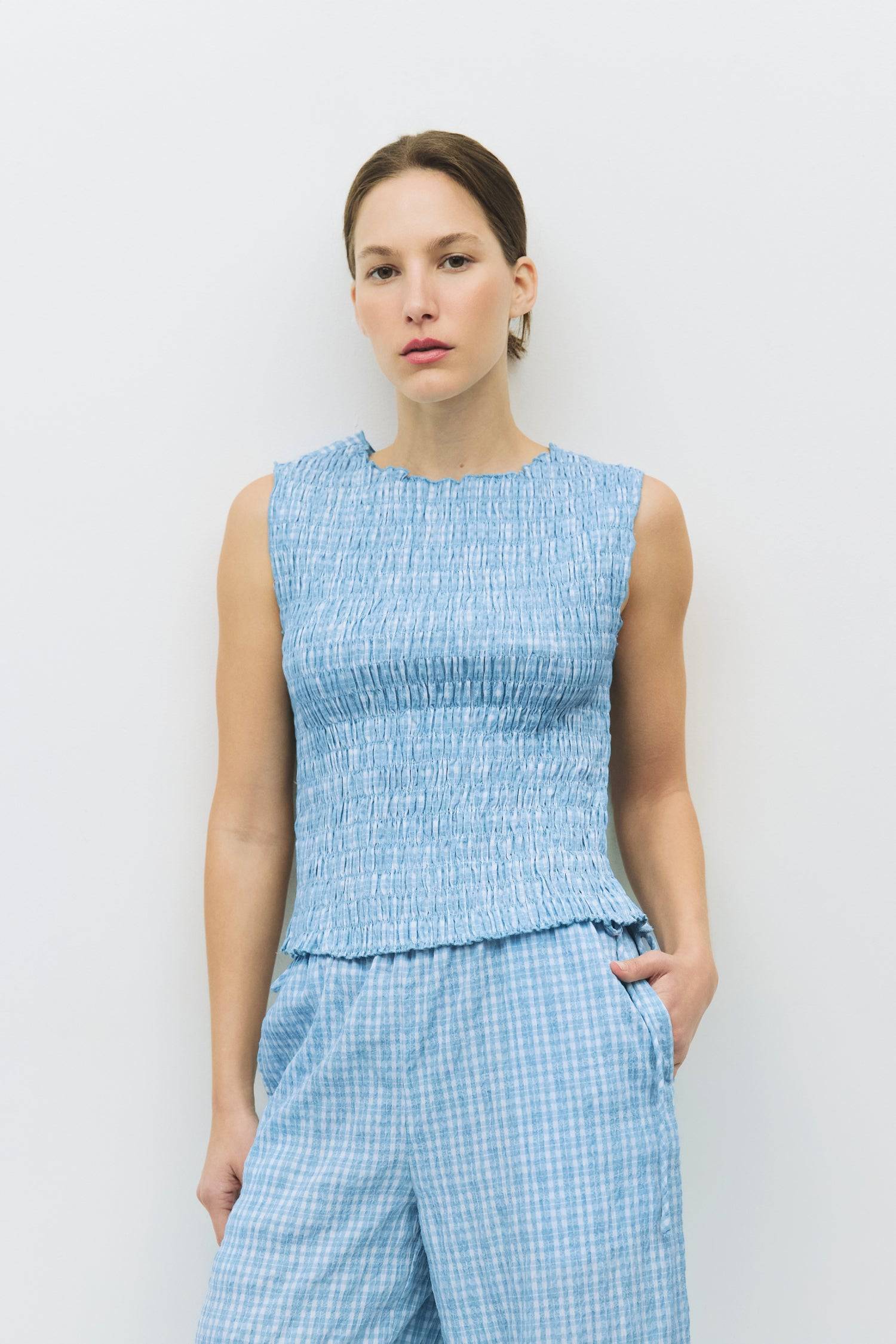 8984554930397, The Ebony Top, Tops, All Row, All Row,allrow,Black,Casual,cf-color-black,cf-color-blush,cf-color-charcoal,cf-color-olive,cf-color-white,cf-size-l,cf-size-m,cf-size-s,cf-vendor-all-row,Charcoal,Cowl,cowl neck,Cozy,Draped,ivory,Khaki,knit,Knit Top,Long Sleeve,Long Sleeve Top,Matching Set,modal,new,set,Sets,Short Sleeve,Spring,Summer,texture,thin,Women's,womens top, Information The Ebony Top features a round neckline and smocked design, with a slightly open back and double tie-back detail. Its s