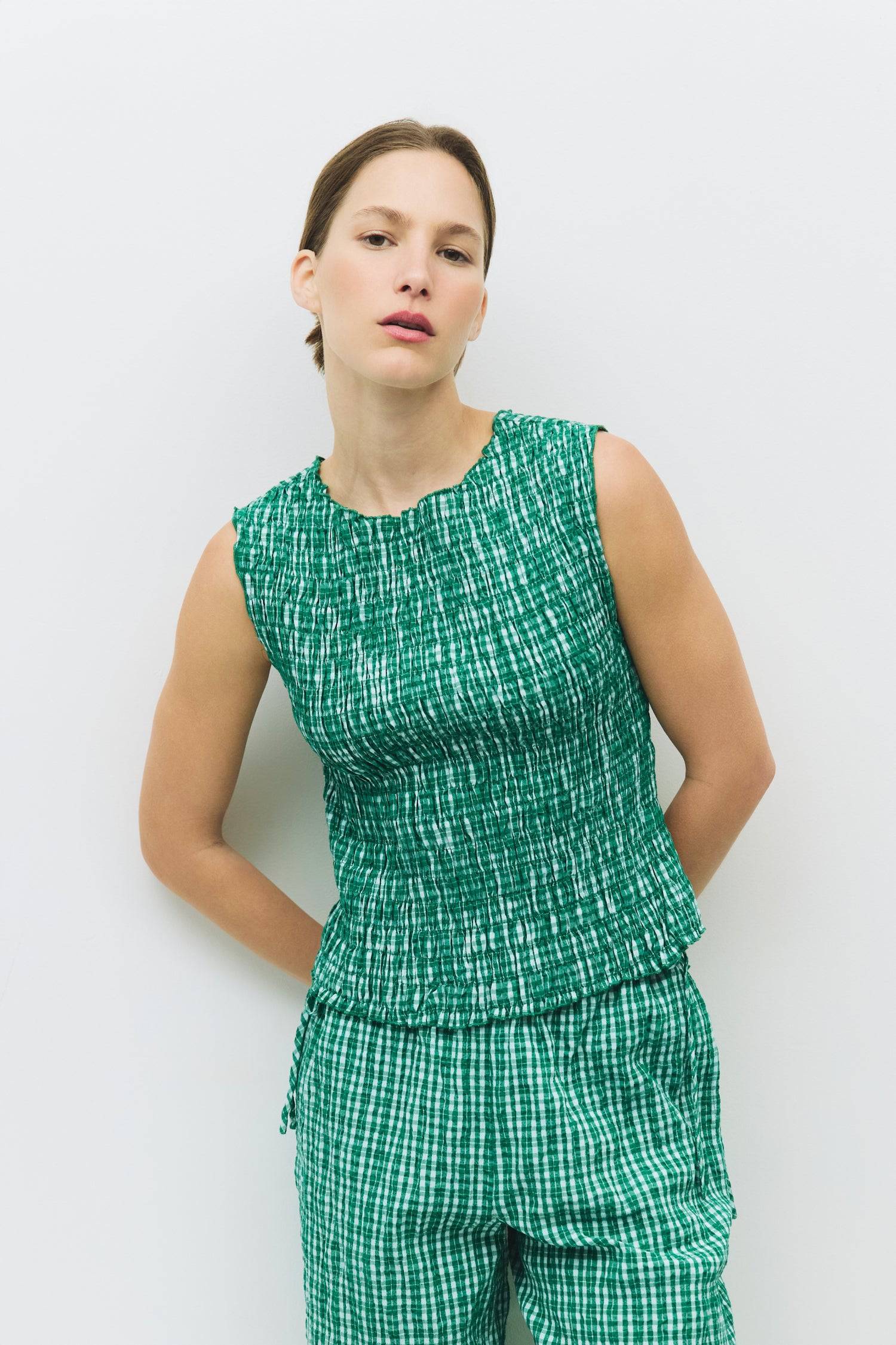 8984554930397, The Ebony Top, Tops, All Row, All Row,allrow,Black,Casual,cf-color-black,cf-color-blush,cf-color-charcoal,cf-color-olive,cf-color-white,cf-size-l,cf-size-m,cf-size-s,cf-vendor-all-row,Charcoal,Cowl,cowl neck,Cozy,Draped,ivory,Khaki,knit,Knit Top,Long Sleeve,Long Sleeve Top,Matching Set,modal,new,set,Sets,Short Sleeve,Spring,Summer,texture,thin,Women's,womens top, Information The Ebony Top features a round neckline and smocked design, with a slightly open back and double tie-back detail. Its s