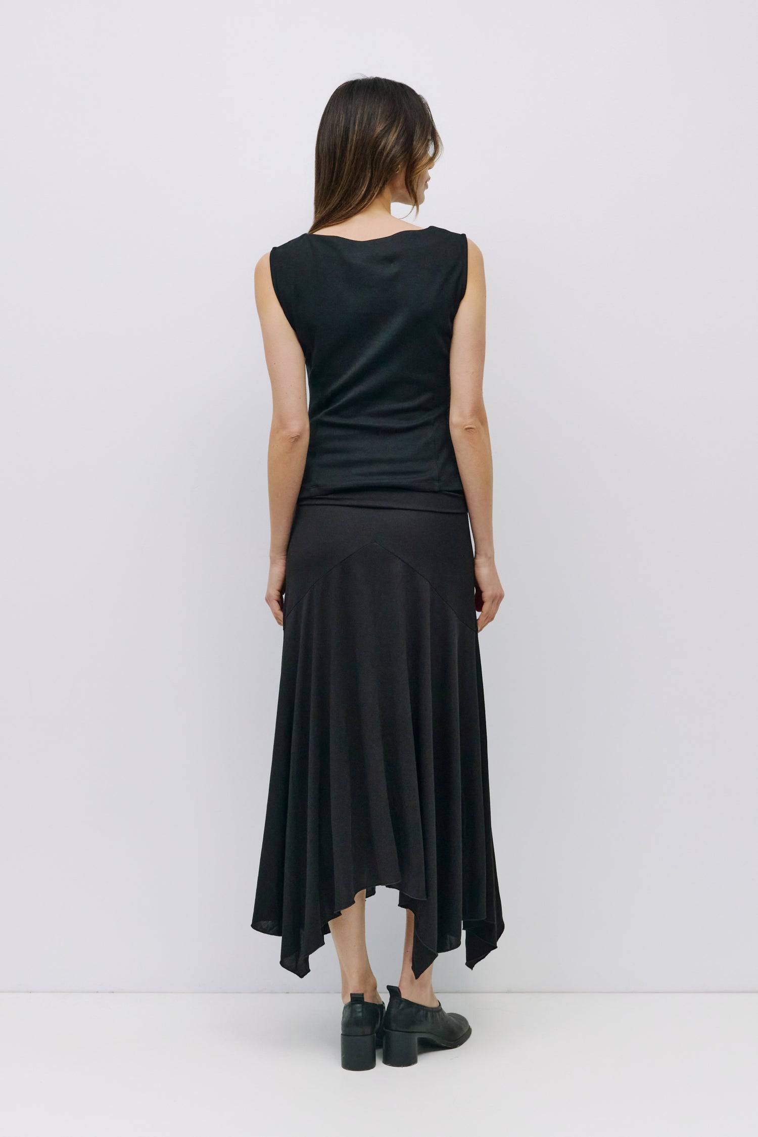 8999198523613, The Alaina Top, Tops, Mod Ref, 90s,asymmetrical,Basic,Basics,Black,Blue,boat neck,boat neckline,Casual,cf-color-black,cf-color-cream,cf-size-l,cf-size-m,cf-size-s,cf-vendor-mod-ref,Comfortable,Cream,Everyday,Form Fitting,Ribbed Fabric,Ribbed Top,Short Sleeve,Spring,stretch,Stretchy,Summer,Tee,Tops,Transitional,white,Women's, Information The Alaina Top is a sleek knit tank with a refined boatneck and an asymmetrical hem for a modern edge. The side pleats and back seams create a fitted silhouet