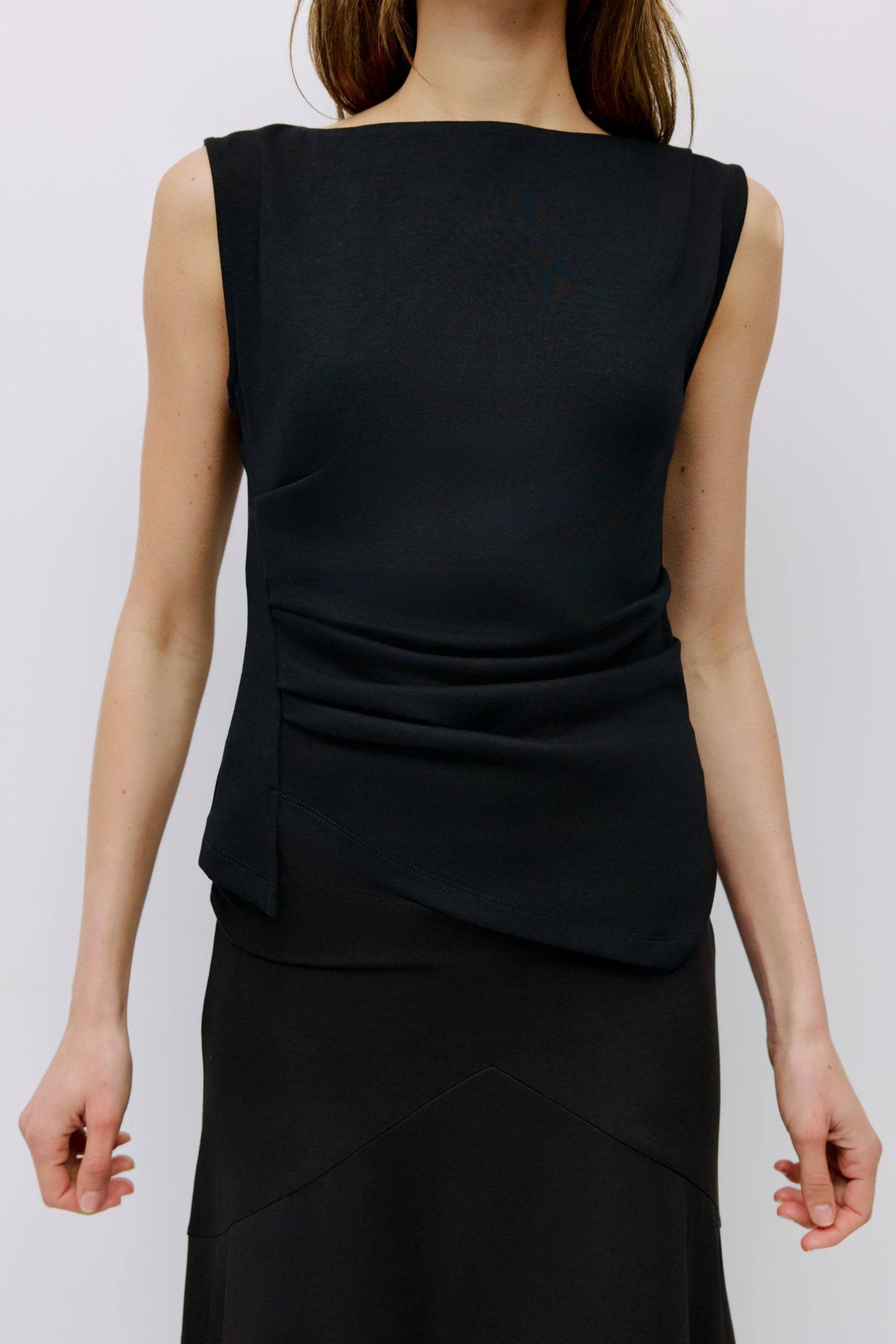 8999198523613, The Alaina Top, Tops, Mod Ref, 90s,asymmetrical,Basic,Basics,Black,Blue,boat neck,boat neckline,Casual,cf-color-black,cf-color-cream,cf-size-l,cf-size-m,cf-size-s,cf-vendor-mod-ref,Comfortable,Cream,Everyday,Form Fitting,Ribbed Fabric,Ribbed Top,Short Sleeve,Spring,stretch,Stretchy,Summer,Tee,Tops,Transitional,white,Women's, Information The Alaina Top is a sleek knit tank with a refined boatneck and an asymmetrical hem for a modern edge. The side pleats and back seams create a fitted silhouet