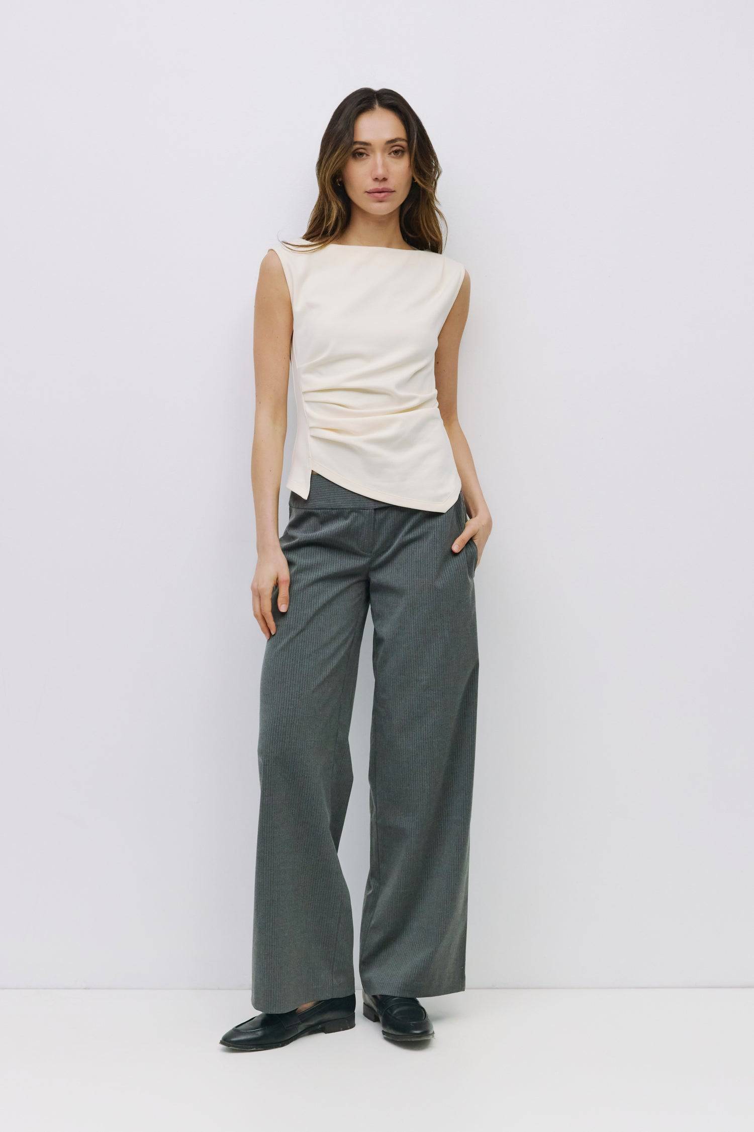 8999198523613, The Alaina Top, Tops, Mod Ref, 90s,asymmetrical,Basic,Basics,Black,Blue,boat neck,boat neckline,Casual,cf-color-black,cf-color-cream,cf-size-l,cf-size-m,cf-size-s,cf-vendor-mod-ref,Comfortable,Cream,Everyday,Form Fitting,Ribbed Fabric,Ribbed Top,Short Sleeve,Spring,stretch,Stretchy,Summer,Tee,Tops,Transitional,white,Women's, Information The Alaina Top is a sleek knit tank with a refined boatneck and an asymmetrical hem for a modern edge. The side pleats and back seams create a fitted silhouet