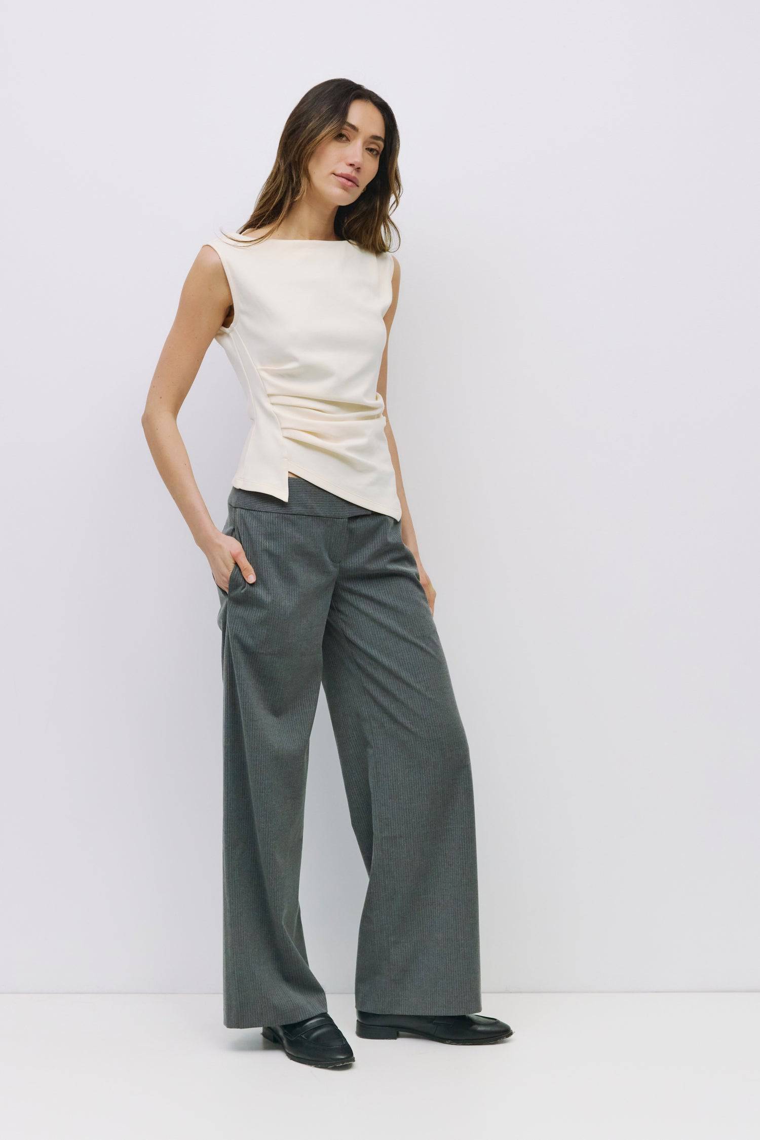 8999198523613, The Alaina Top, Tops, Mod Ref, 90s,asymmetrical,Basic,Basics,Black,Blue,boat neck,boat neckline,Casual,cf-color-black,cf-color-cream,cf-size-l,cf-size-m,cf-size-s,cf-vendor-mod-ref,Comfortable,Cream,Everyday,Form Fitting,Ribbed Fabric,Ribbed Top,Short Sleeve,Spring,stretch,Stretchy,Summer,Tee,Tops,Transitional,white,Women's, Information The Alaina Top is a sleek knit tank with a refined boatneck and an asymmetrical hem for a modern edge. The side pleats and back seams create a fitted silhouet