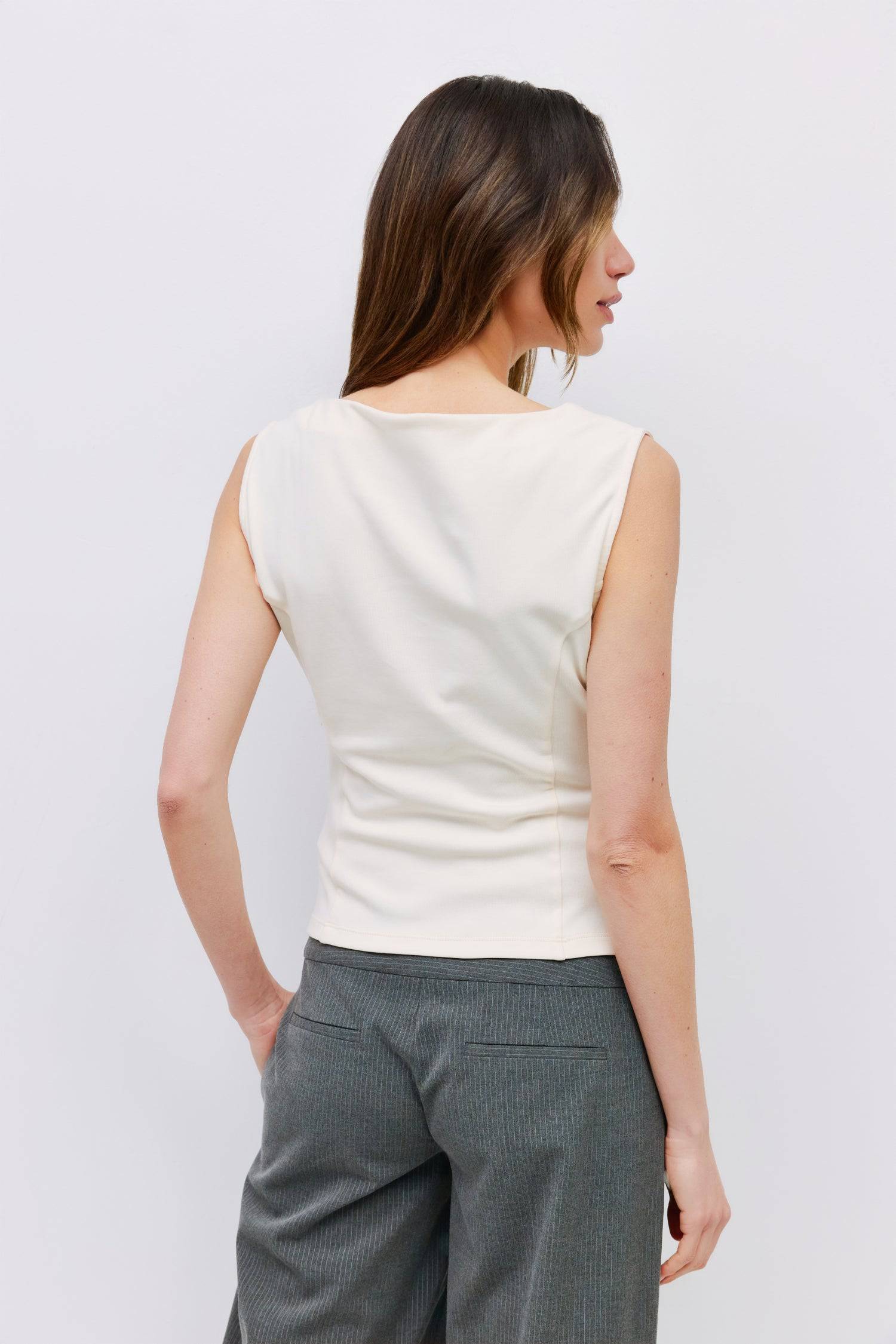 8999198523613, The Alaina Top, Tops, Mod Ref, 90s,asymmetrical,Basic,Basics,Black,Blue,boat neck,boat neckline,Casual,cf-color-black,cf-color-cream,cf-size-l,cf-size-m,cf-size-s,cf-vendor-mod-ref,Comfortable,Cream,Everyday,Form Fitting,Ribbed Fabric,Ribbed Top,Short Sleeve,Spring,stretch,Stretchy,Summer,Tee,Tops,Transitional,white,Women's, Information The Alaina Top is a sleek knit tank with a refined boatneck and an asymmetrical hem for a modern edge. The side pleats and back seams create a fitted silhouet