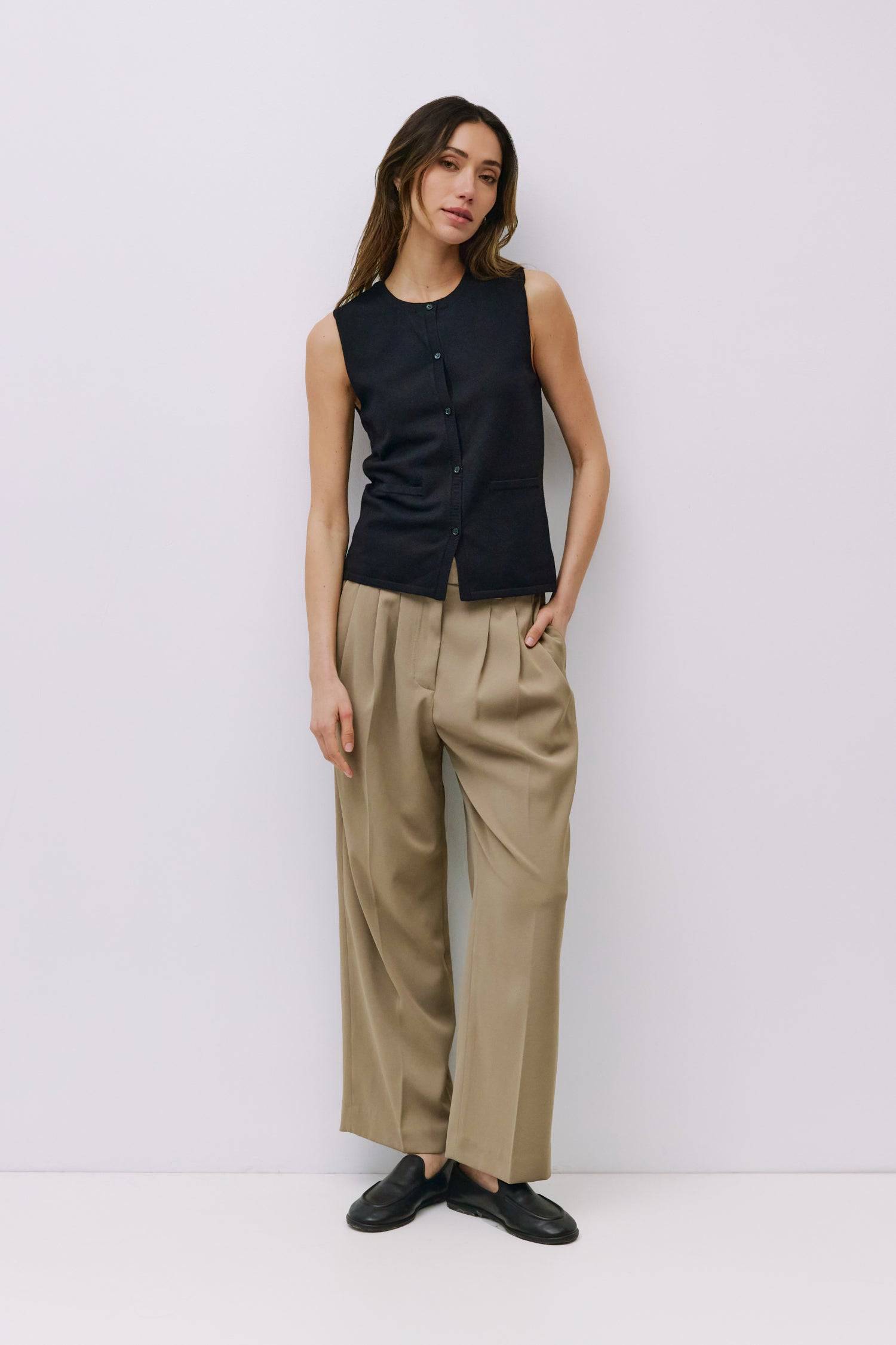 9023144493277, The Dominique Top, Tops, Mod Ref, Basic,Basics,Black,Button Front,Button up,Buttons,Cardigan,Casual,cf-color-black,cf-size-l,cf-size-m,cf-size-s,cf-size-xl,cf-vendor-mod-ref,Everyday,Knit,Mod Ref,modref,new,Relaxed,Relaxed Fit,Sets,Sleeveless,Sleeveless Top,Soft Knit,Transitional,white,Women's, Information The Dominique Top is a fitted sleeveless knit vest with a ribbed neckline and front placket. Detailed with pearl button closures, it effortlessly blends a polished look with the comfort of