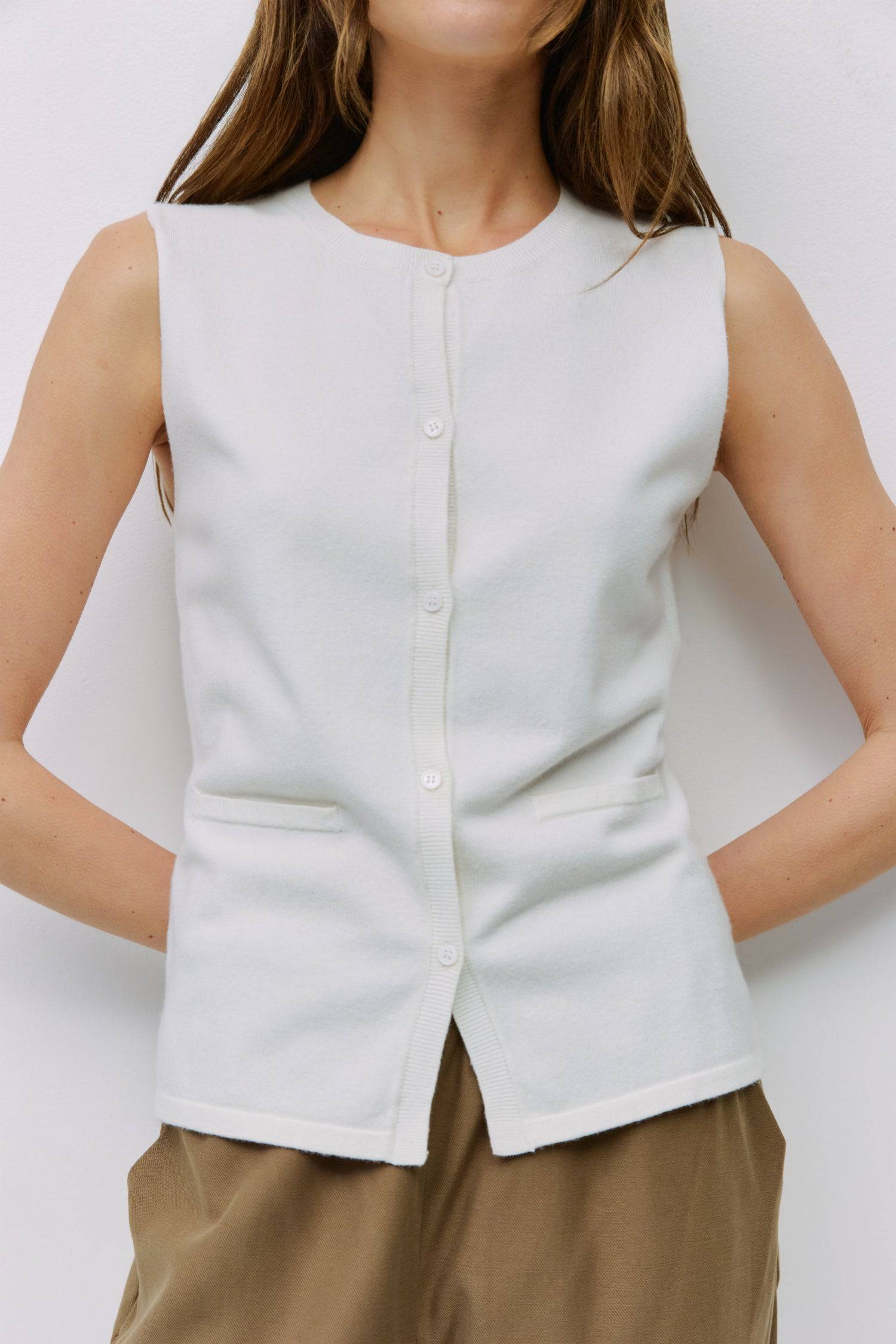 9023144493277, The Dominique Top, Tops, Mod Ref, Basic,Basics,Black,Button Front,Button up,Buttons,Cardigan,Casual,cf-color-black,cf-size-l,cf-size-m,cf-size-s,cf-size-xl,cf-vendor-mod-ref,Everyday,Knit,Mod Ref,modref,new,Relaxed,Relaxed Fit,Sets,Sleeveless,Sleeveless Top,Soft Knit,Transitional,white,Women's, Information The Dominique Top is a fitted sleeveless knit vest with a ribbed neckline and front placket. Detailed with pearl button closures, it effortlessly blends a polished look with the comfort of